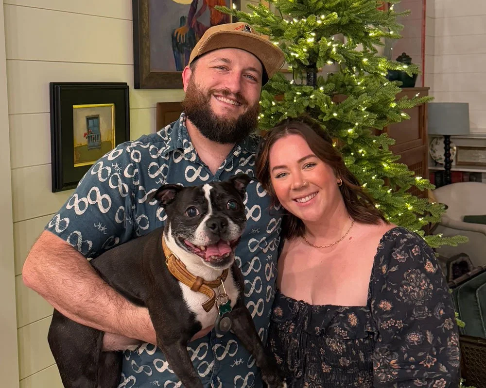 Owners Jimmy, holding his Boston terrier Rhino, and Erica