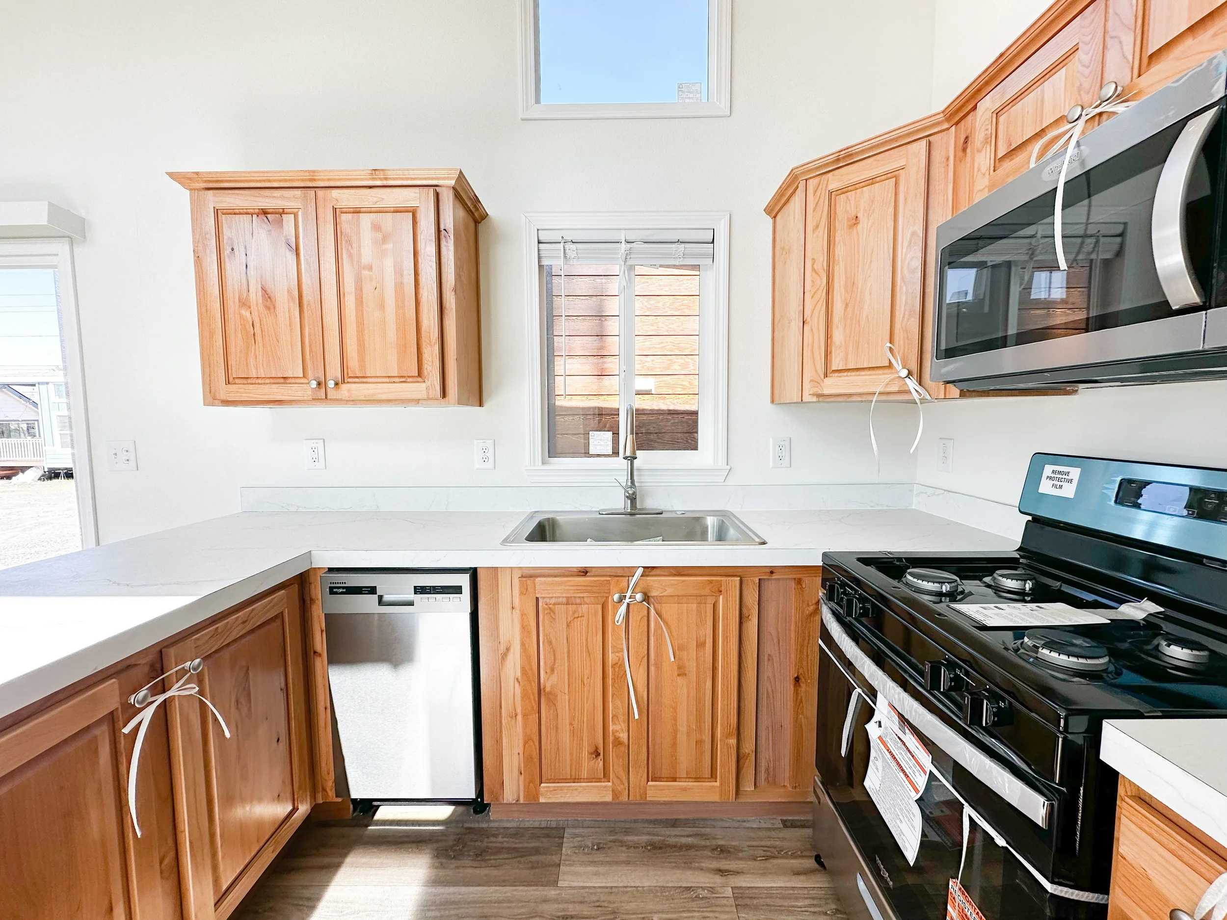 Kitchen with added dishwasher and microwave