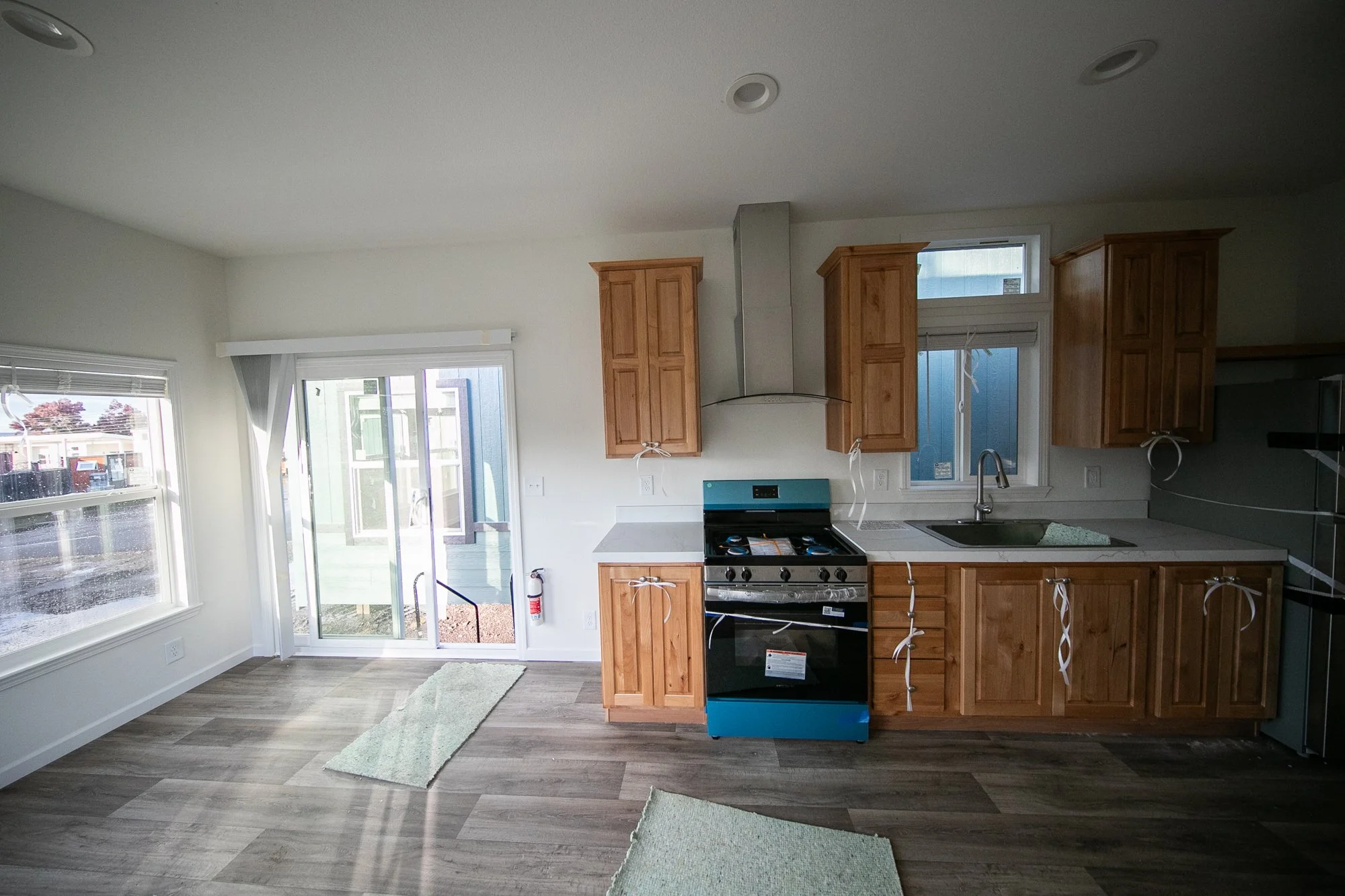 Kitchen in the in-stock Willow park model at our Portland, OR lot