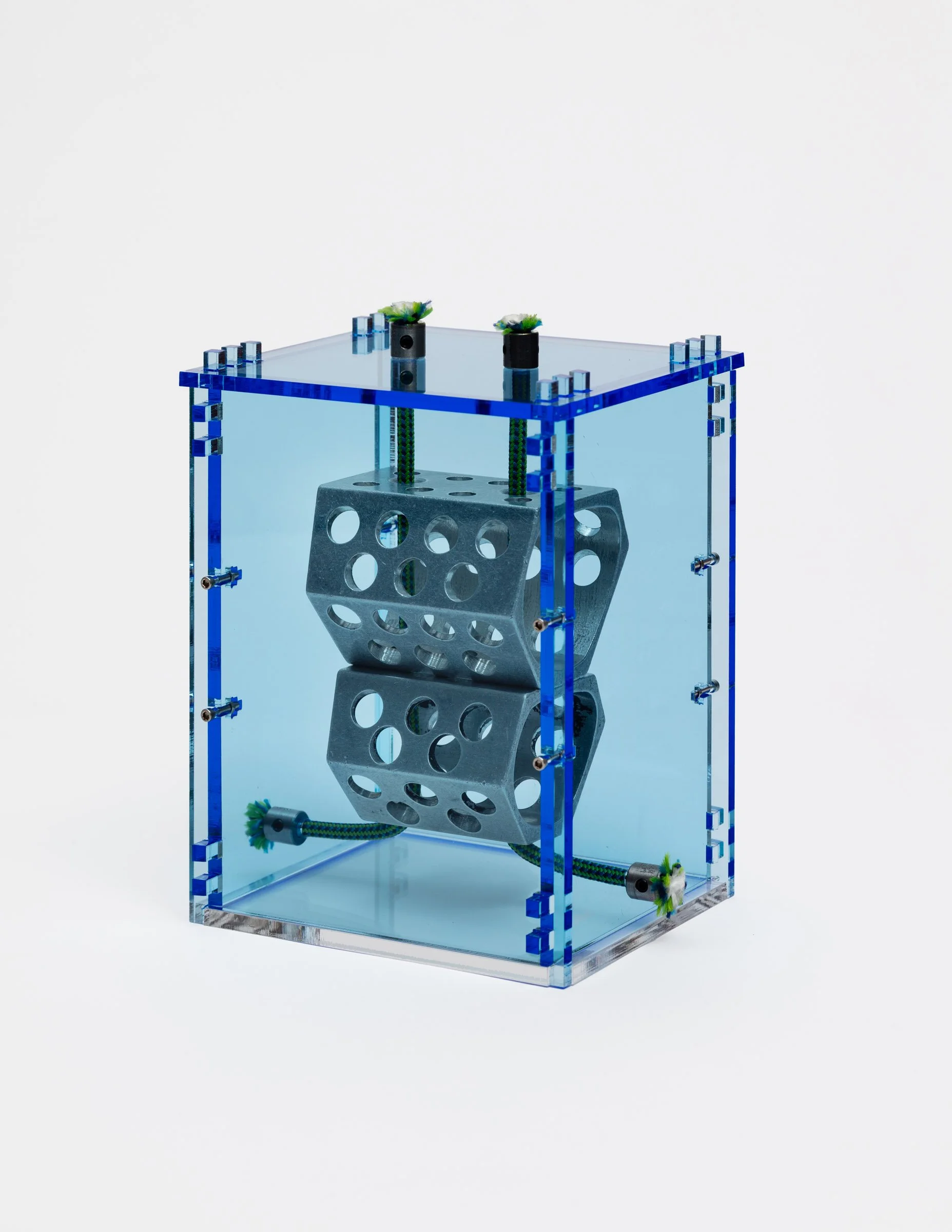   Drilled Hexentrics (ca. 2108),   2025 Chouinard Equipment Hexentrics climbing nuts, plexiglass, nylon cord, stainless steel Dimensions variable  Photo by LF Documentation