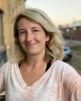 Clear Mind Counseling therapist in Minnesota with straight blonde hair, wearing a black top and smiling warmly, providing supportive and client-focused mental health counseling.