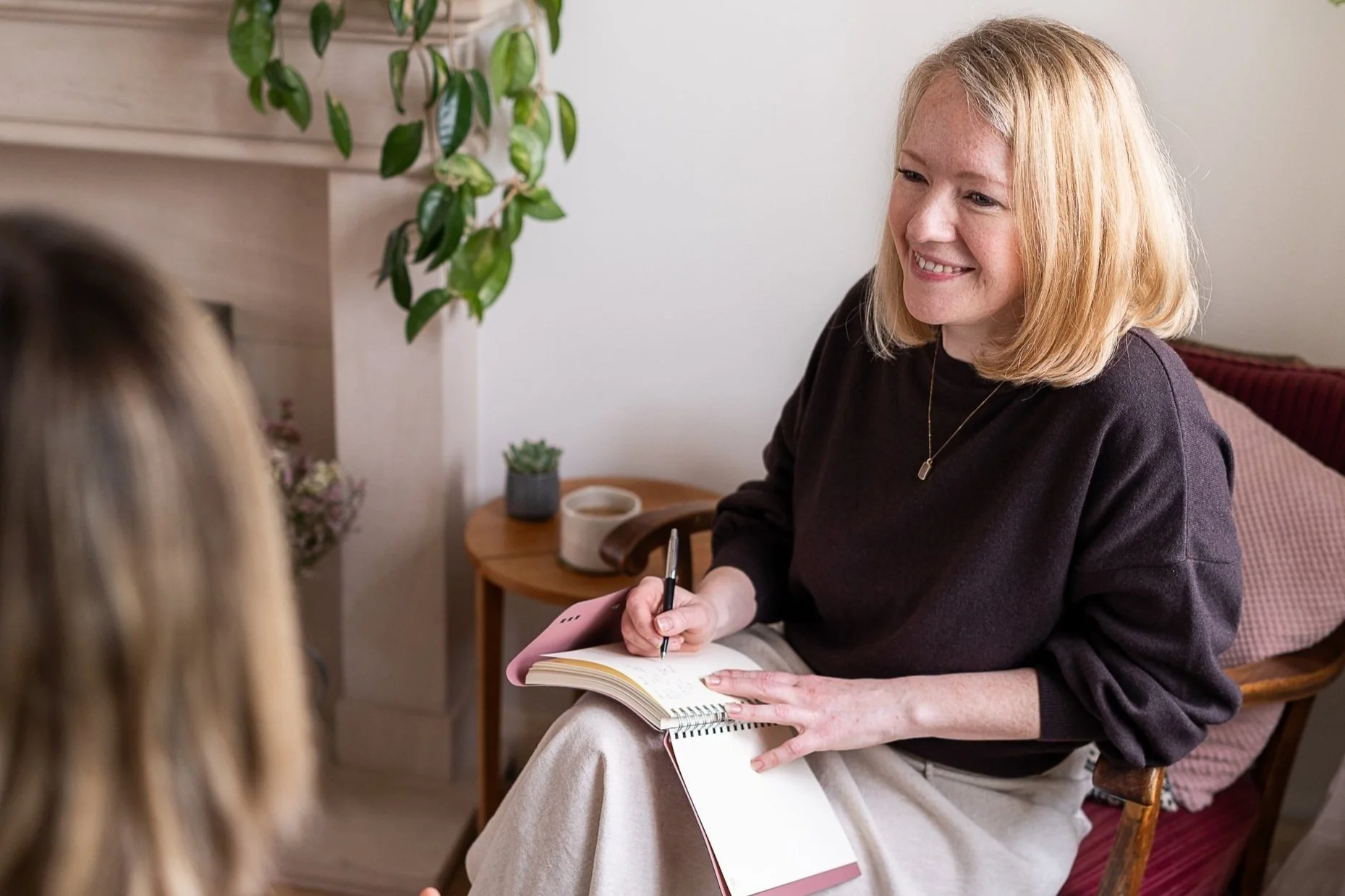 Lauren Johns, The Should I Stay Or Should I Go Coach, in a room having a coaching conversation with a client