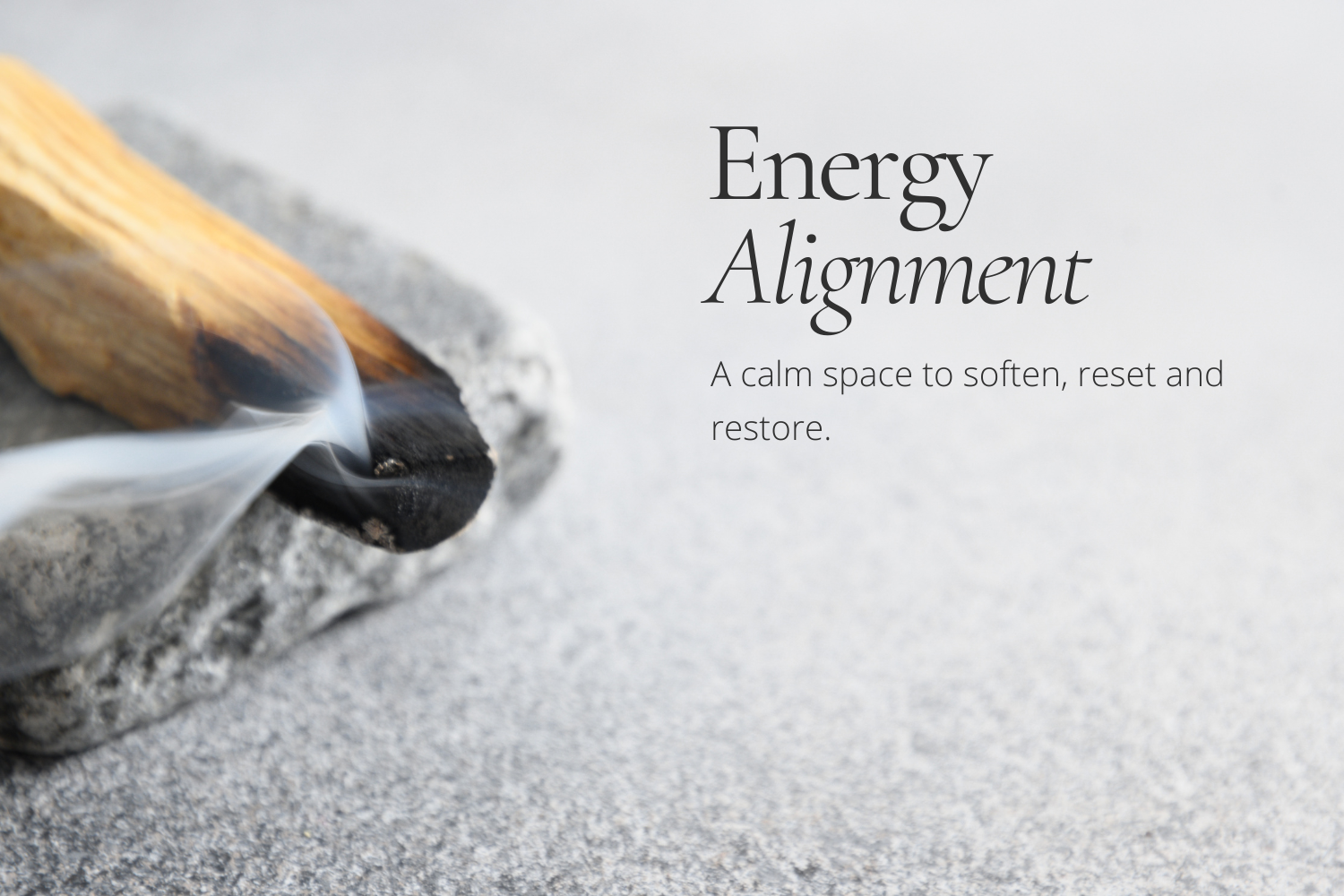 Palo santo gently burning on a grey concrete stone against a soft white background, with wisps of smoke rising. Text overlay reads: “Energy Alignment — a calm space to soften, reset, and restore.”