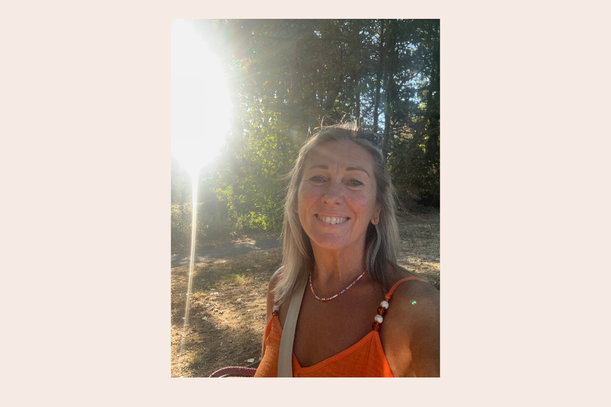 Nicky Massey smiling outdoors in the sunshine, founded of The Reclaimed Woman