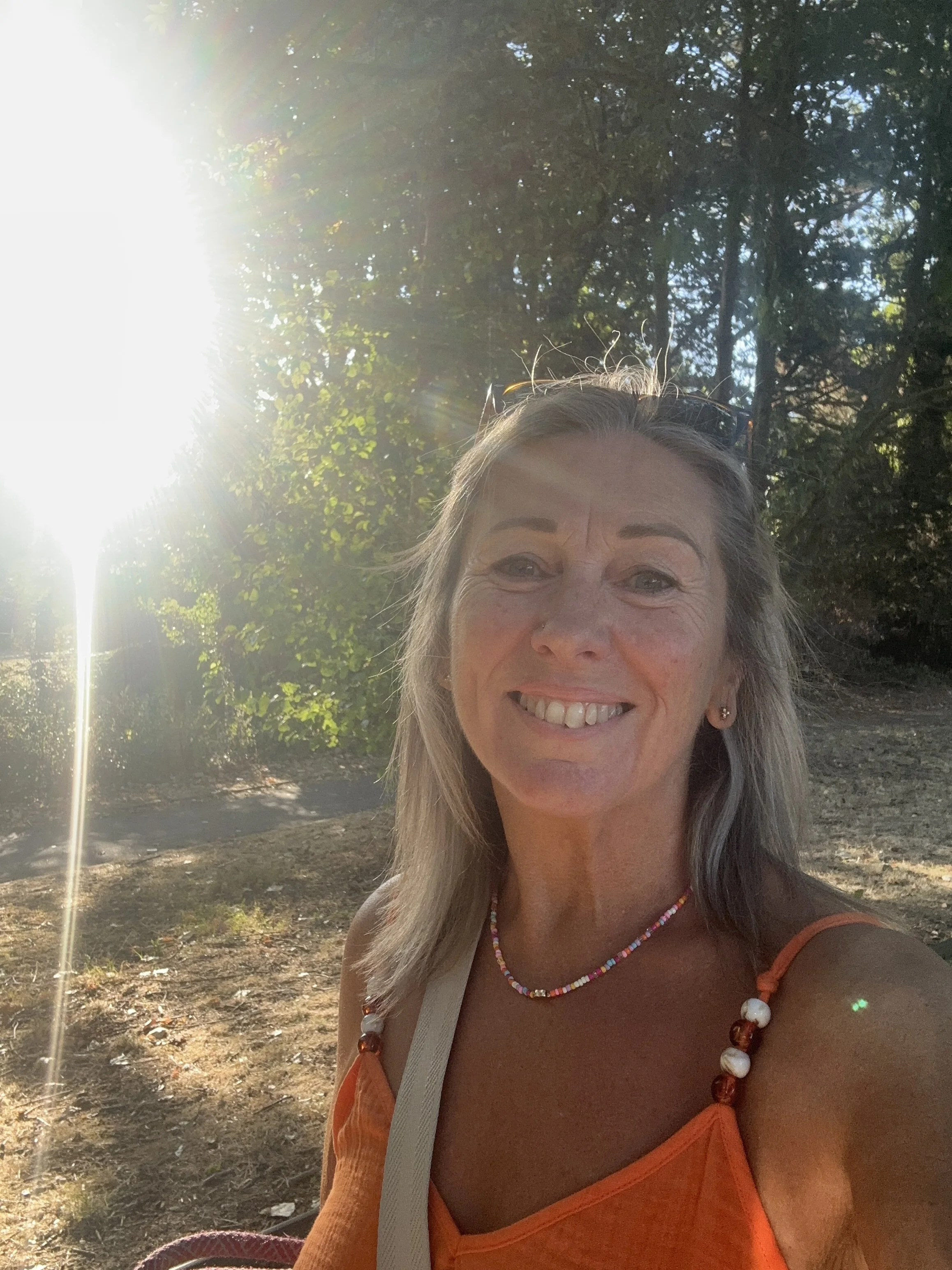 Nicky Massey The Reclaimed Woman Coach Walking In the Woods with the Sun Shinning