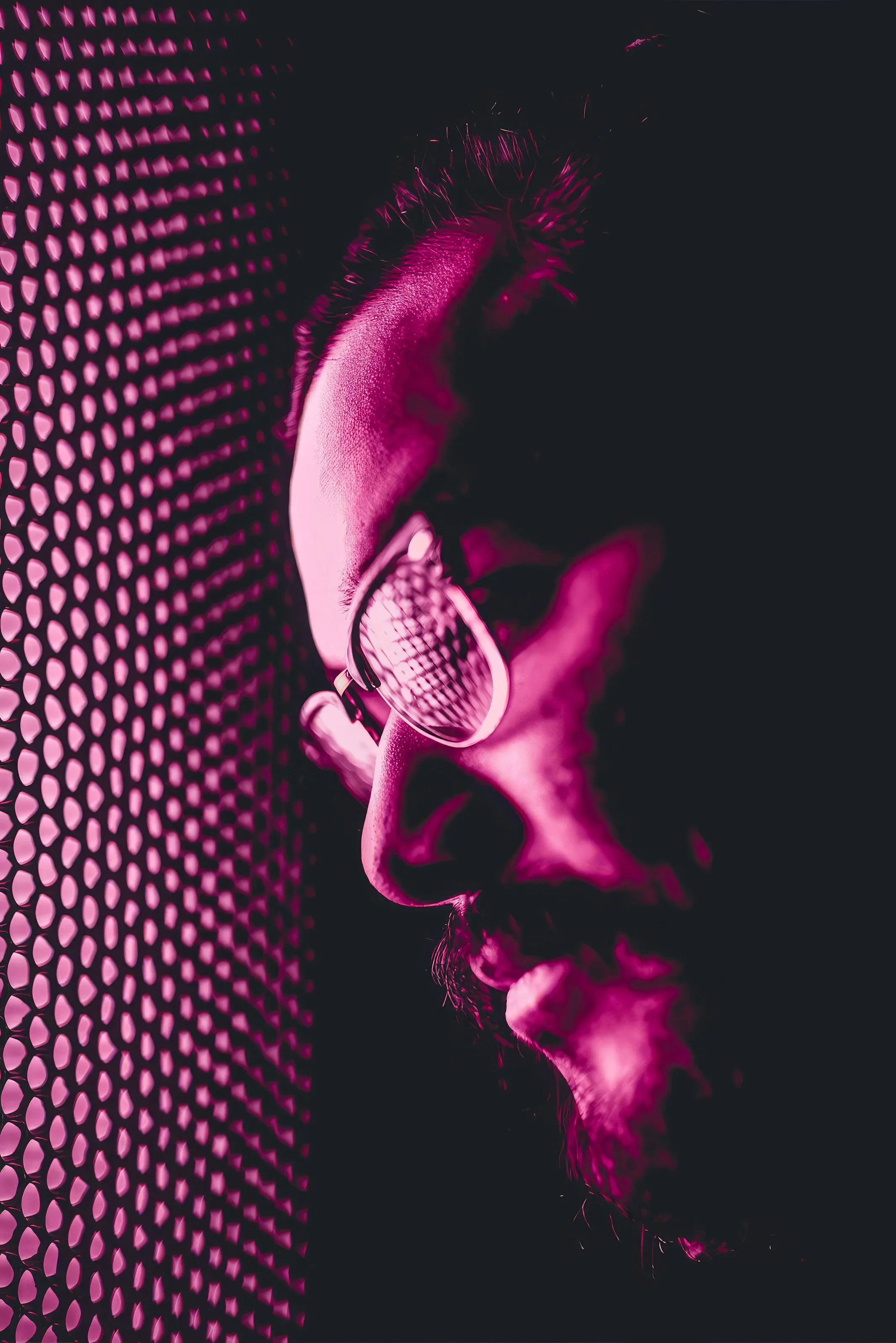 Cinematic musician portrait with magenta lighting. Creative branding by Southend photographer Matt Daley.