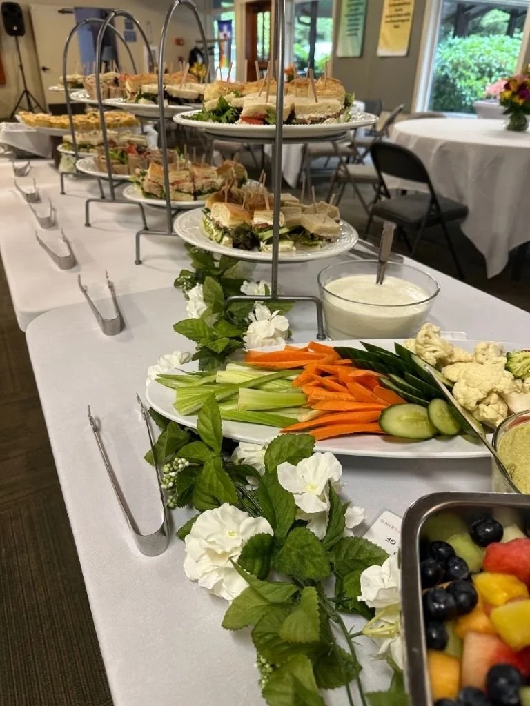 A buffet of vegetables and finger sandwiches