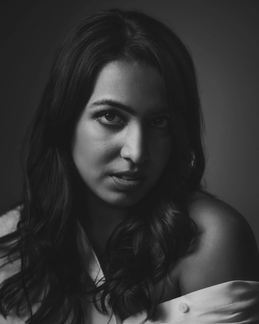 Black and white editorial portrait of Toronto Lifestyle Photographer Pooja Maheshwari of Lenses for Love.
