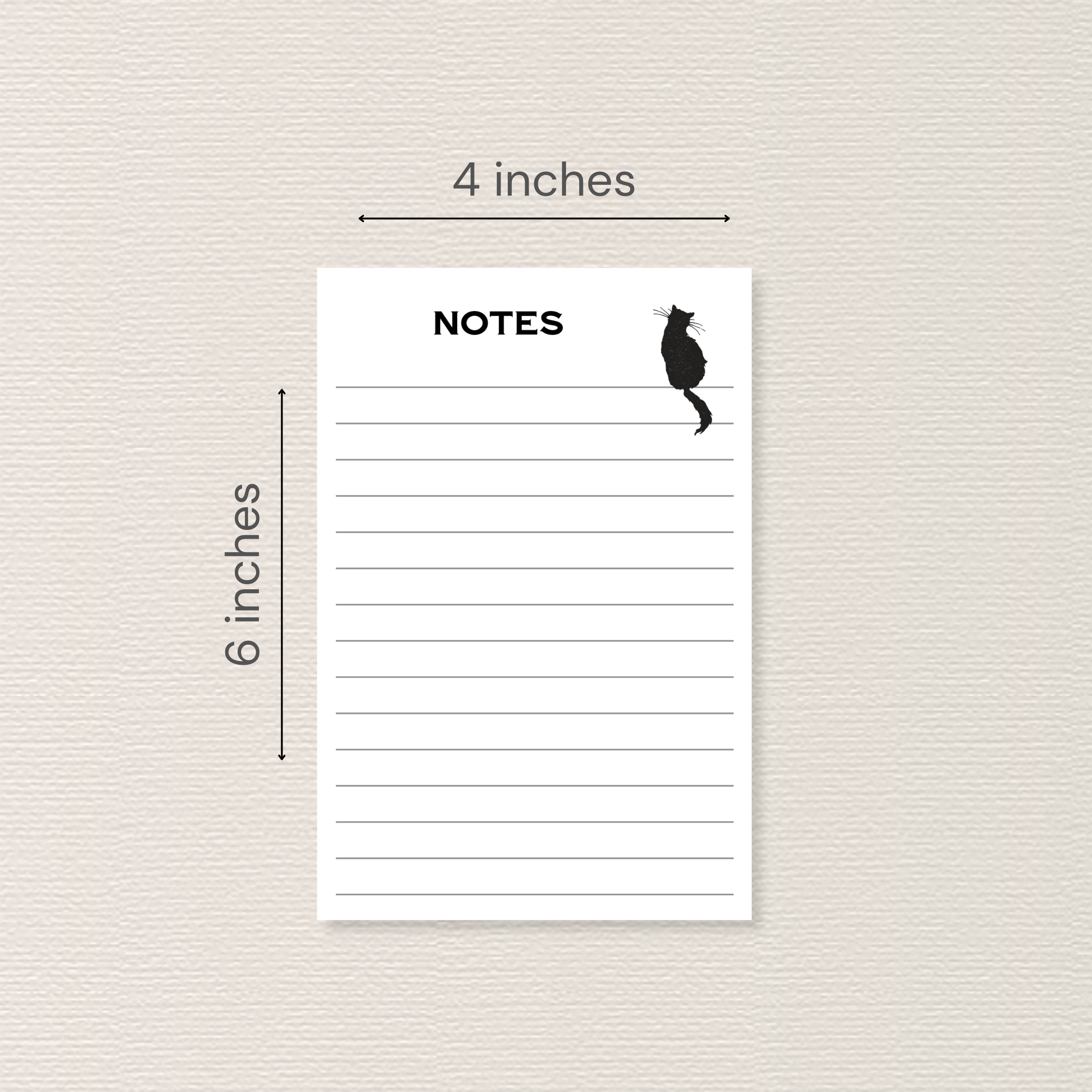 Notepad with black cat sitting on top line. Arrows and text next to image indicate the pad measures 4x6 inches.