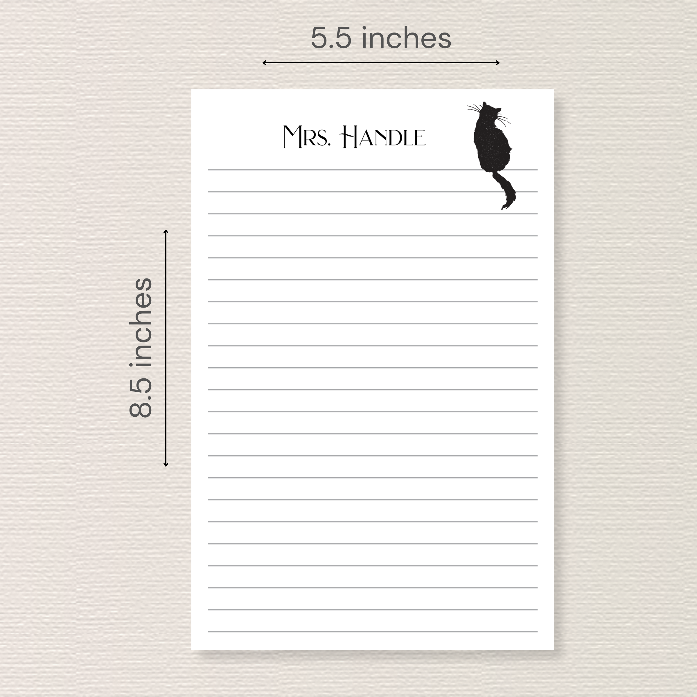 Notepad with black cat sitting on top line. Arrows and text next to image indicate the pad measures 5.5x8.5 inches.