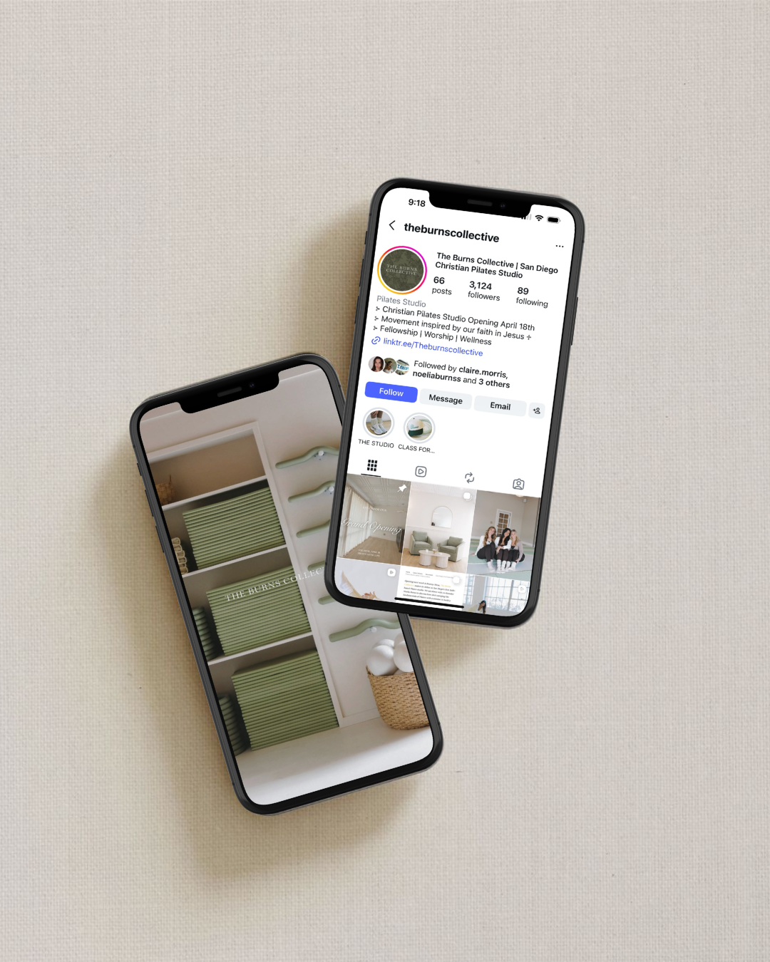 Two smartphones lying on a beige surface, one displaying an Instagram profile for The Burns Collective, a Christian Pilates Studio in San Diego, and the other showing a photo of shelves with green folded towels and baskets.