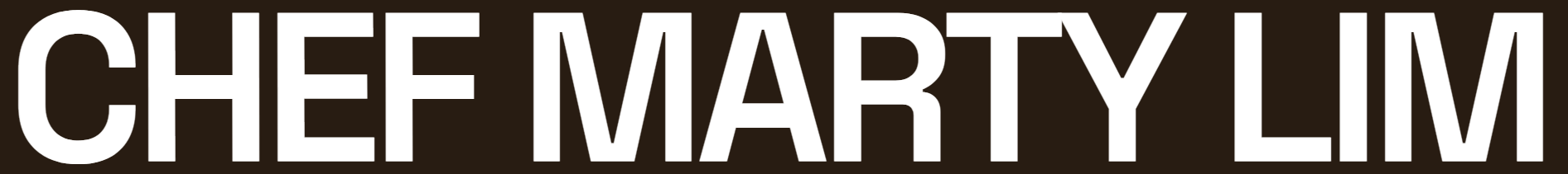 A logo with a black and grey cross design and the word "FITNESS" written across the middle in black outlined text