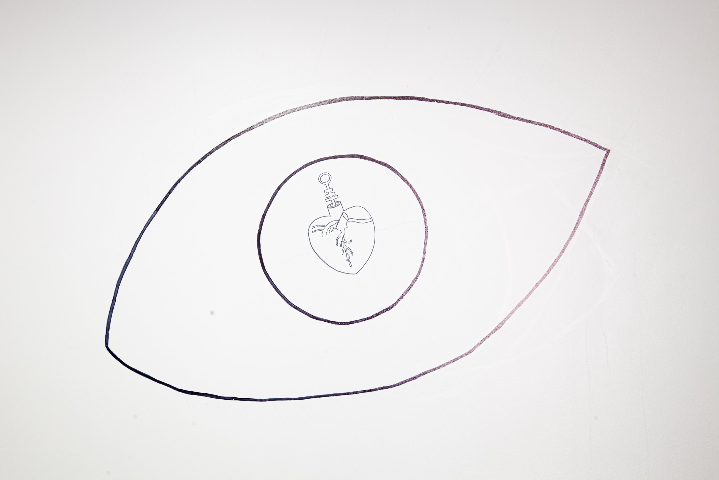 A line drawing of a large eye with a heart and a medical syringe in the center of the iris
