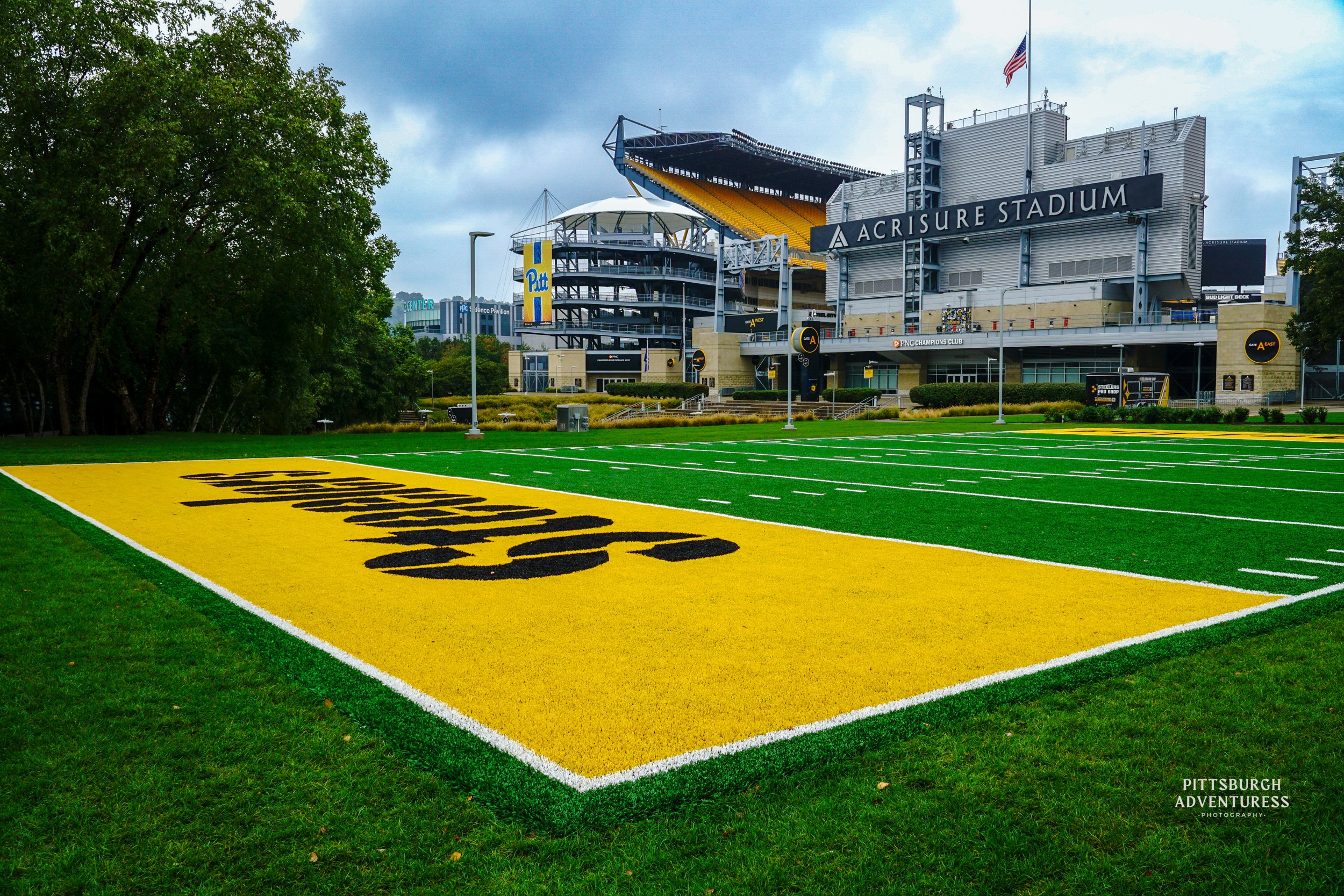 Pittsburgh landmark Heinz Field end zone with yellow lettering and stadium seating. Steelers Football. 
