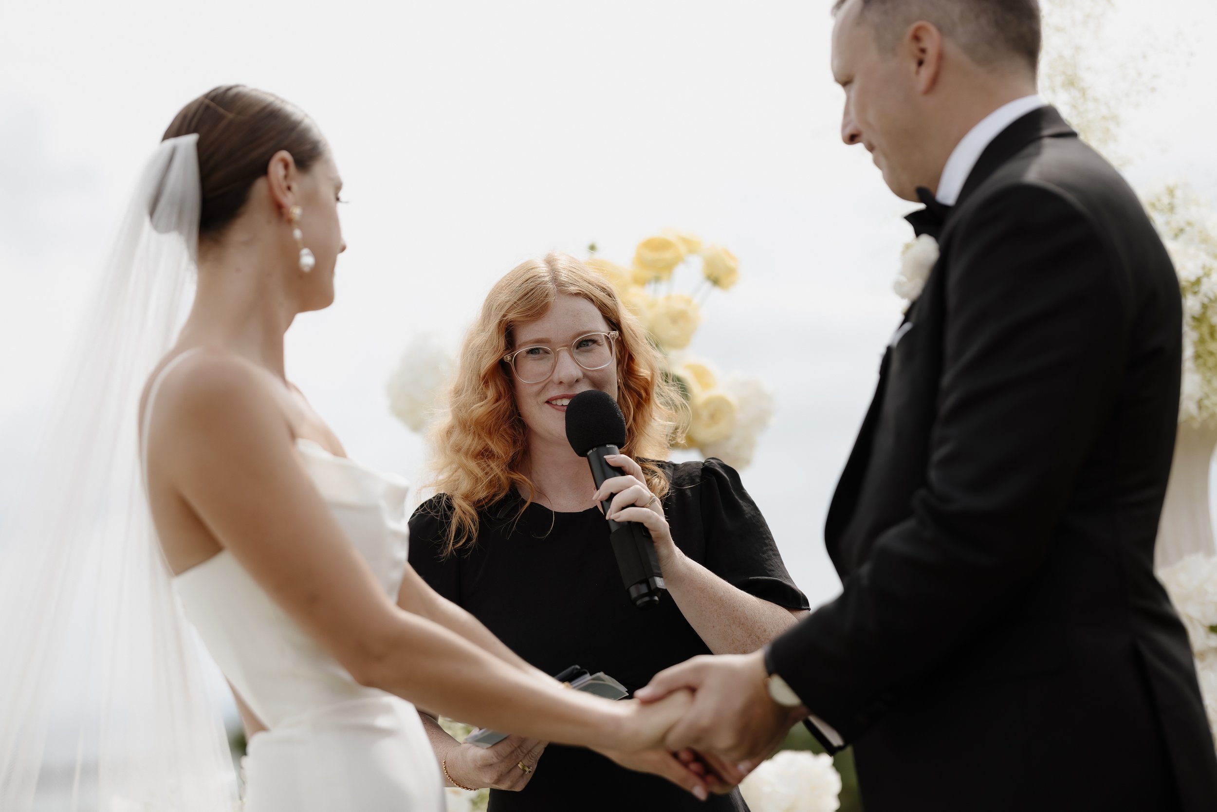 waiheke marriage celebrant marrying a bride and groom at Mudbrick