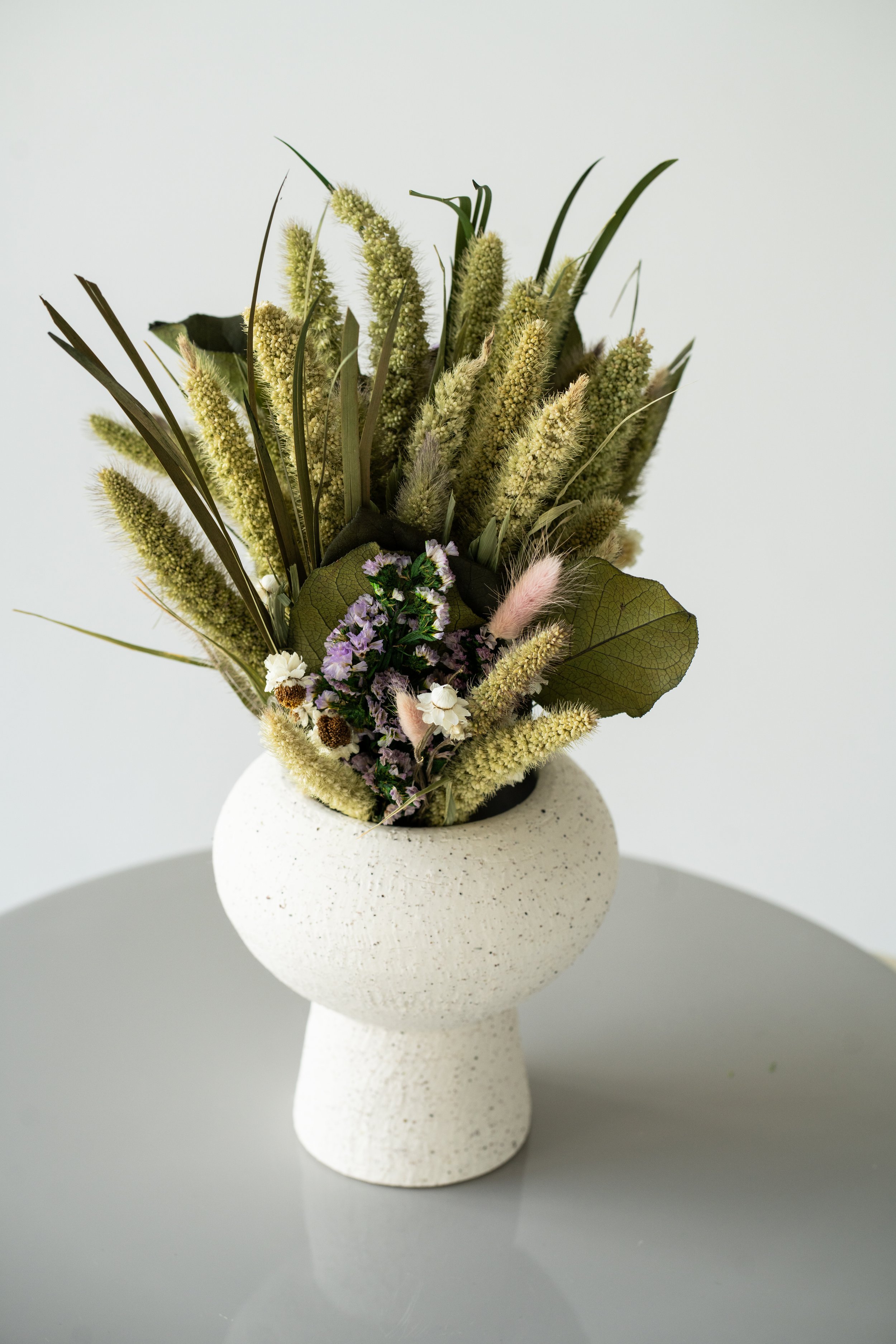 Arrangement with white cruz vase