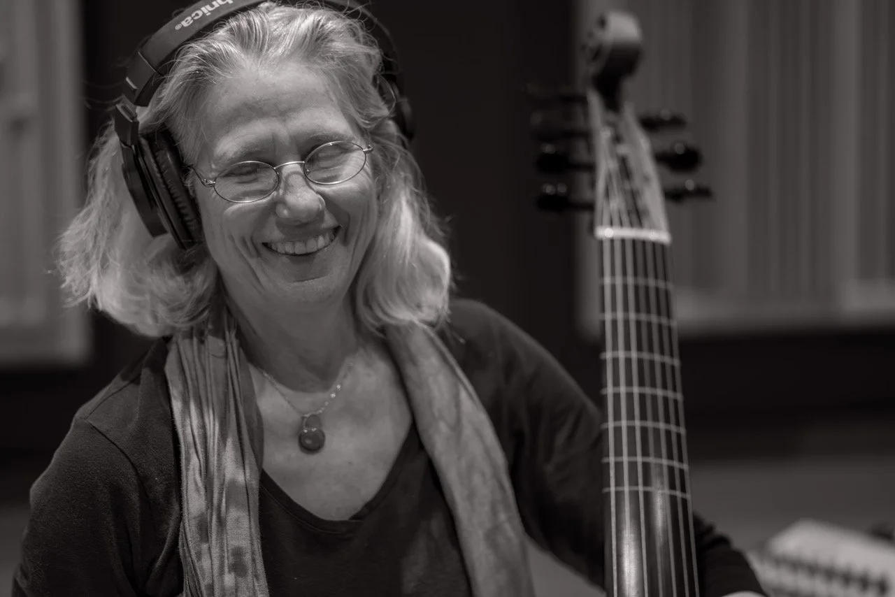 cas smiling w_instrument.jpeg