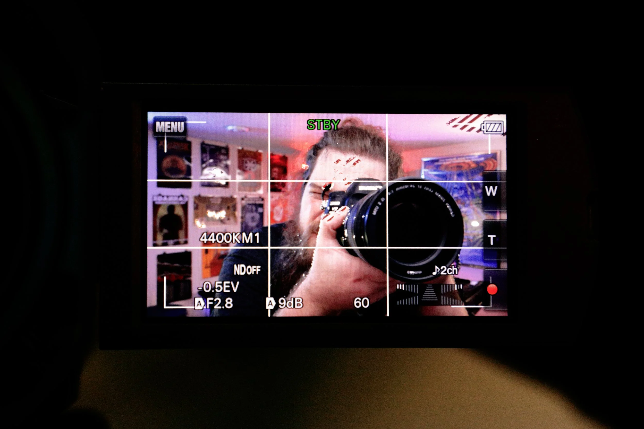 Sam Wagner- self portrait-Suede Studio-Holding a Camera taking a photo of another cameras screen