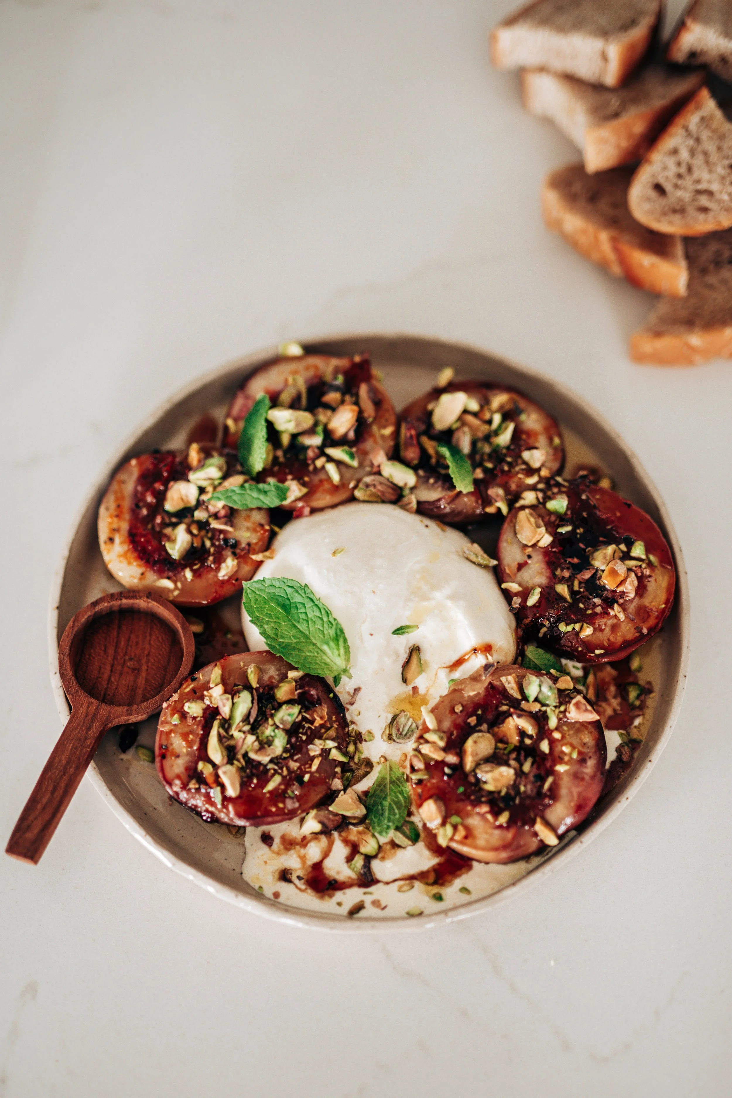 Burrata with honey roasted peaches &amp; pistachio