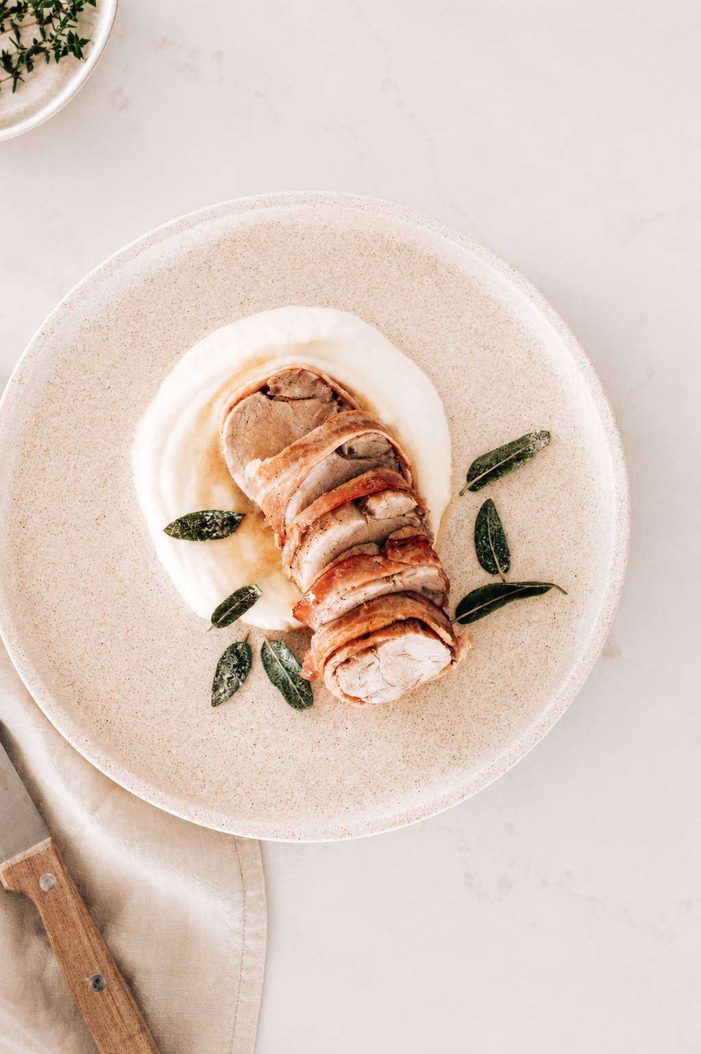 Bacon wrapped pork with parsnip puree &amp; crispy sage