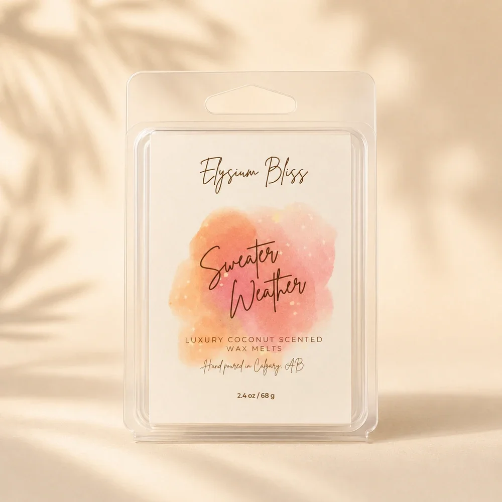 Elysium Bliss Sweater Weather luxury coconut wax melts in a clear clamshell with watercolour label, on a warm cream background with soft palm-frond shadow.