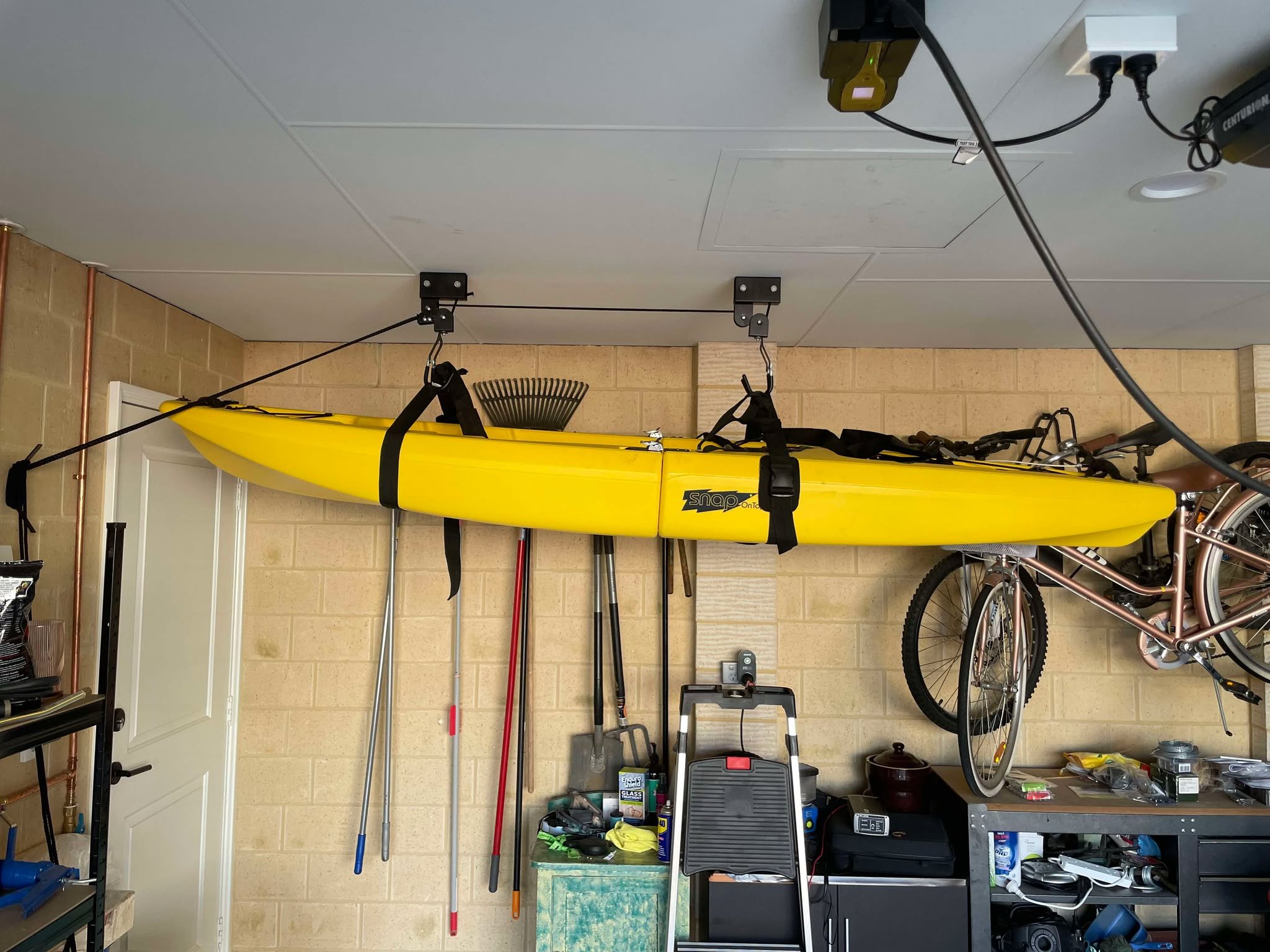 Kayak hung on roof in garage
