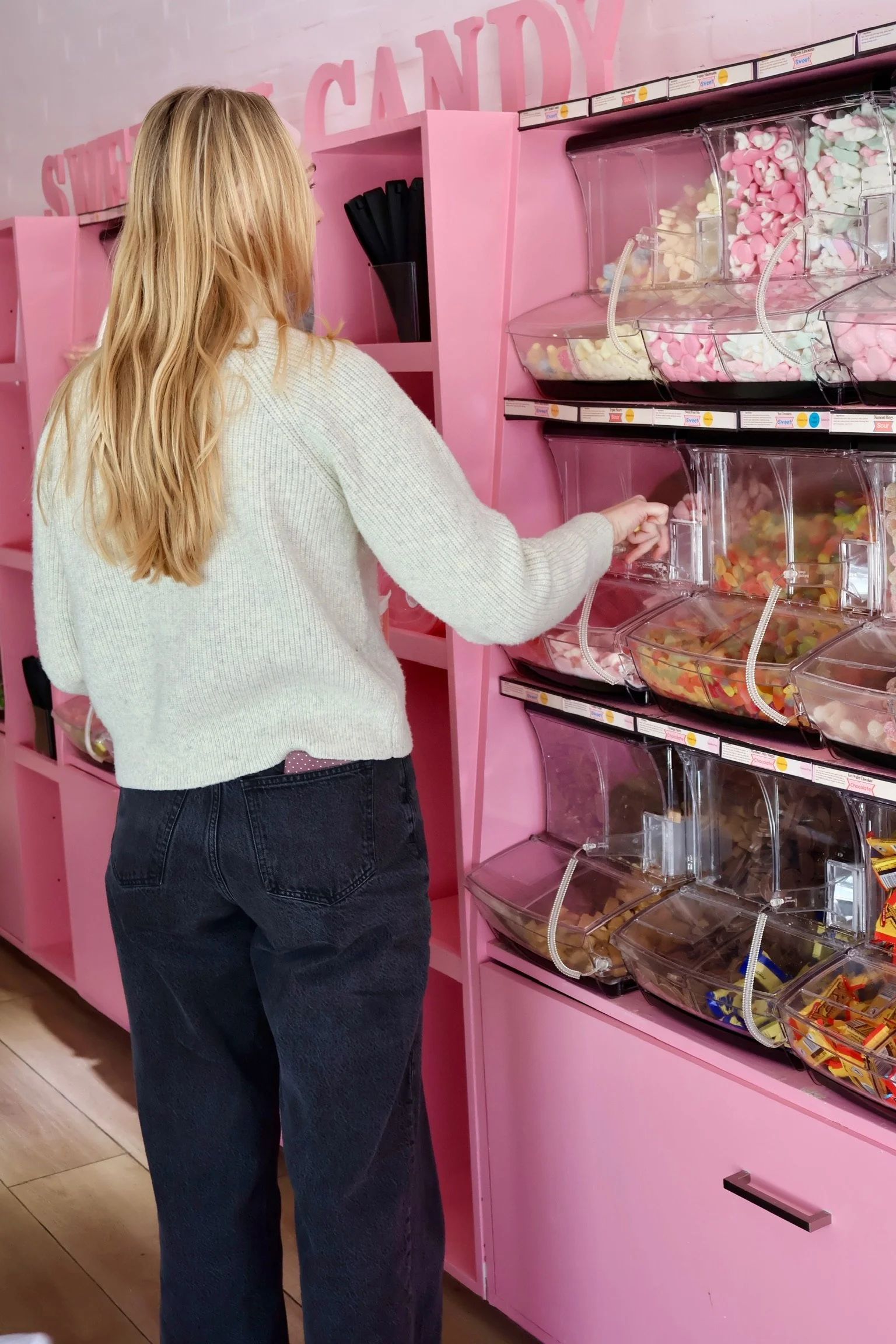 Tampa girl picking Swedish candy from candy bin