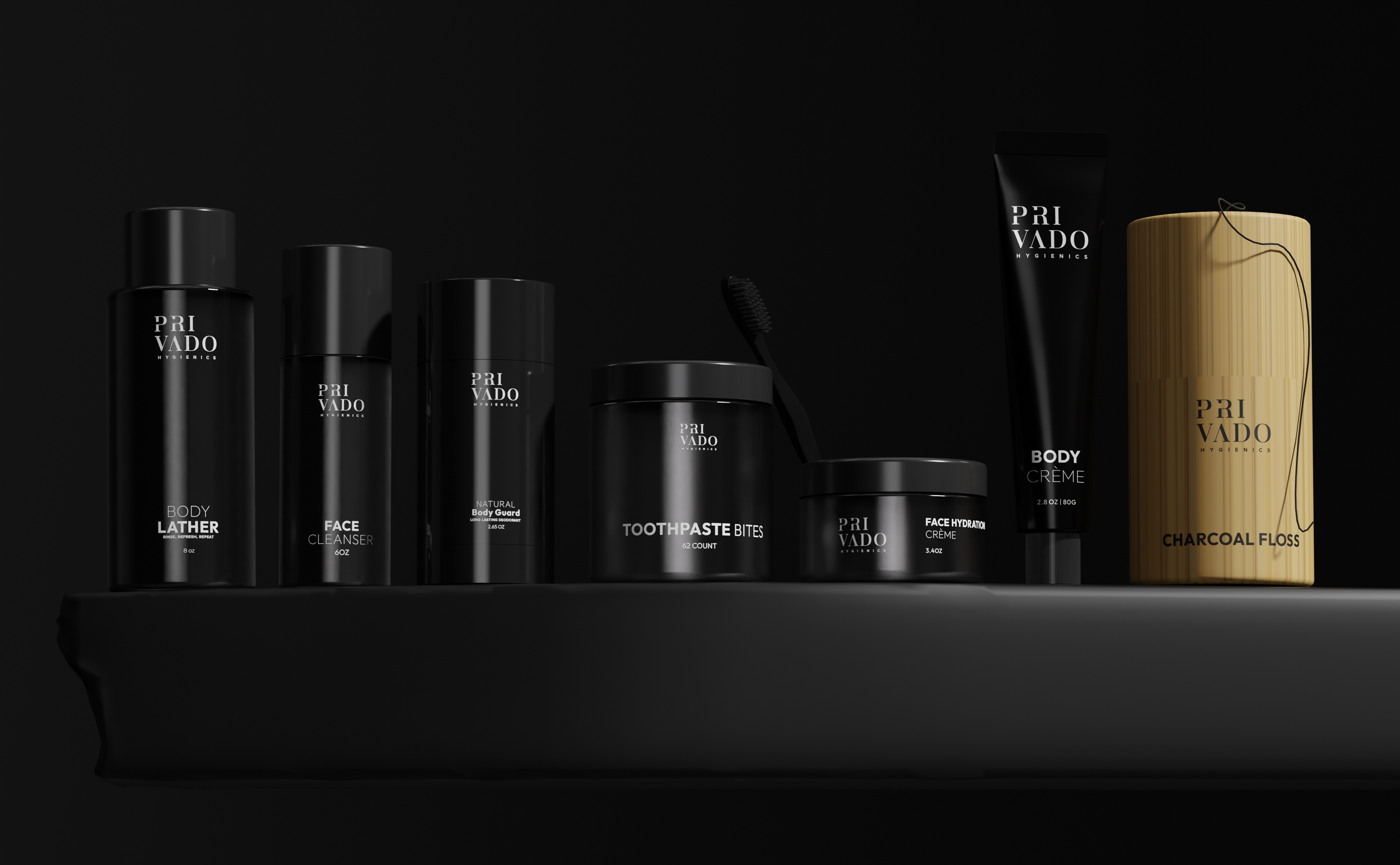 Collection of black and gold personal care products from Pri Vado Hygienics, including body lather, face cleanser, natural body guard, toothpaste bites, face hydrating crème, body crème, and charcoaal floss, arranged on a dark surface against a black background.