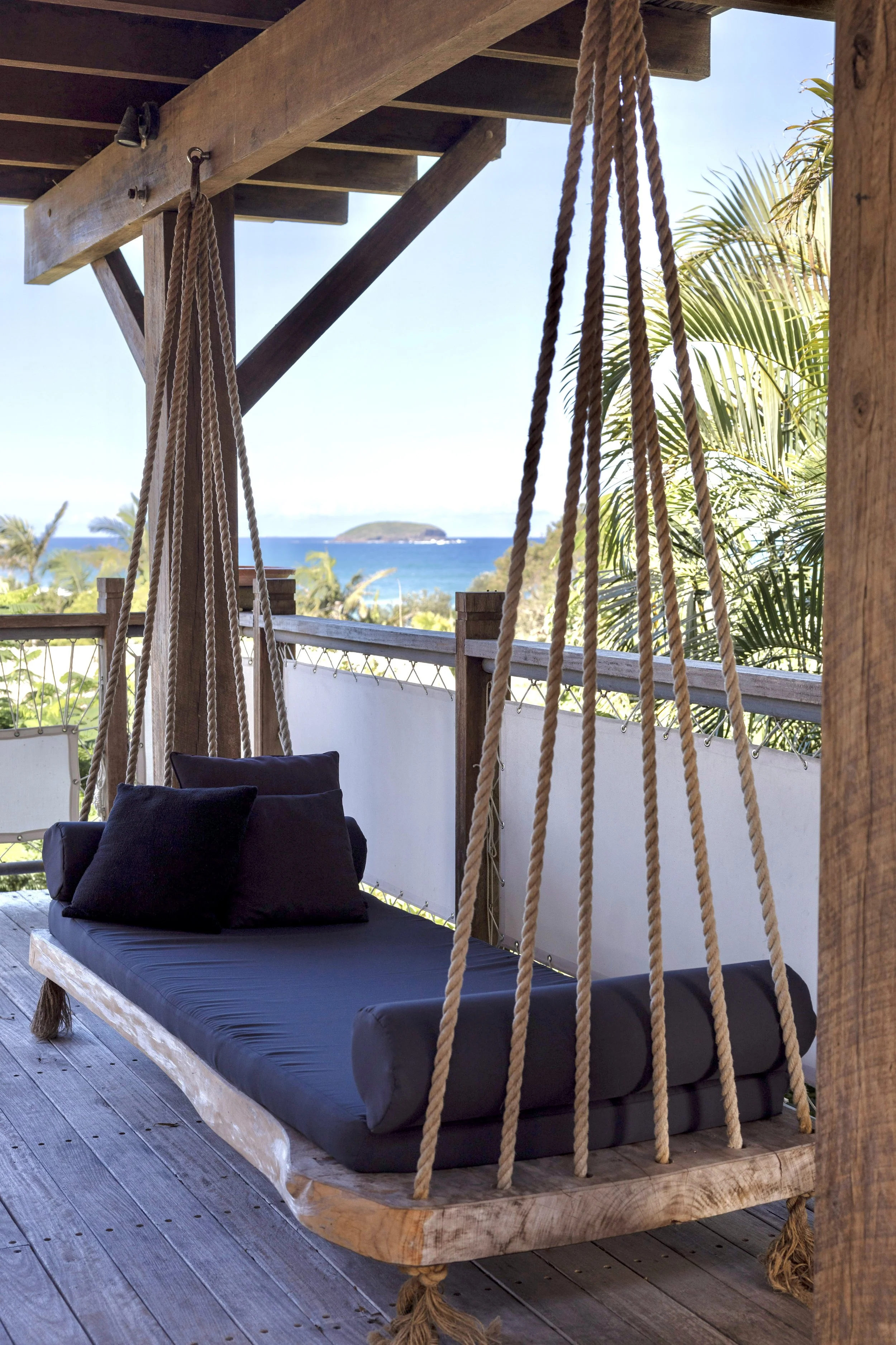 Swinging daybeds overlooking the Pacific Ocean at Haven Oceana