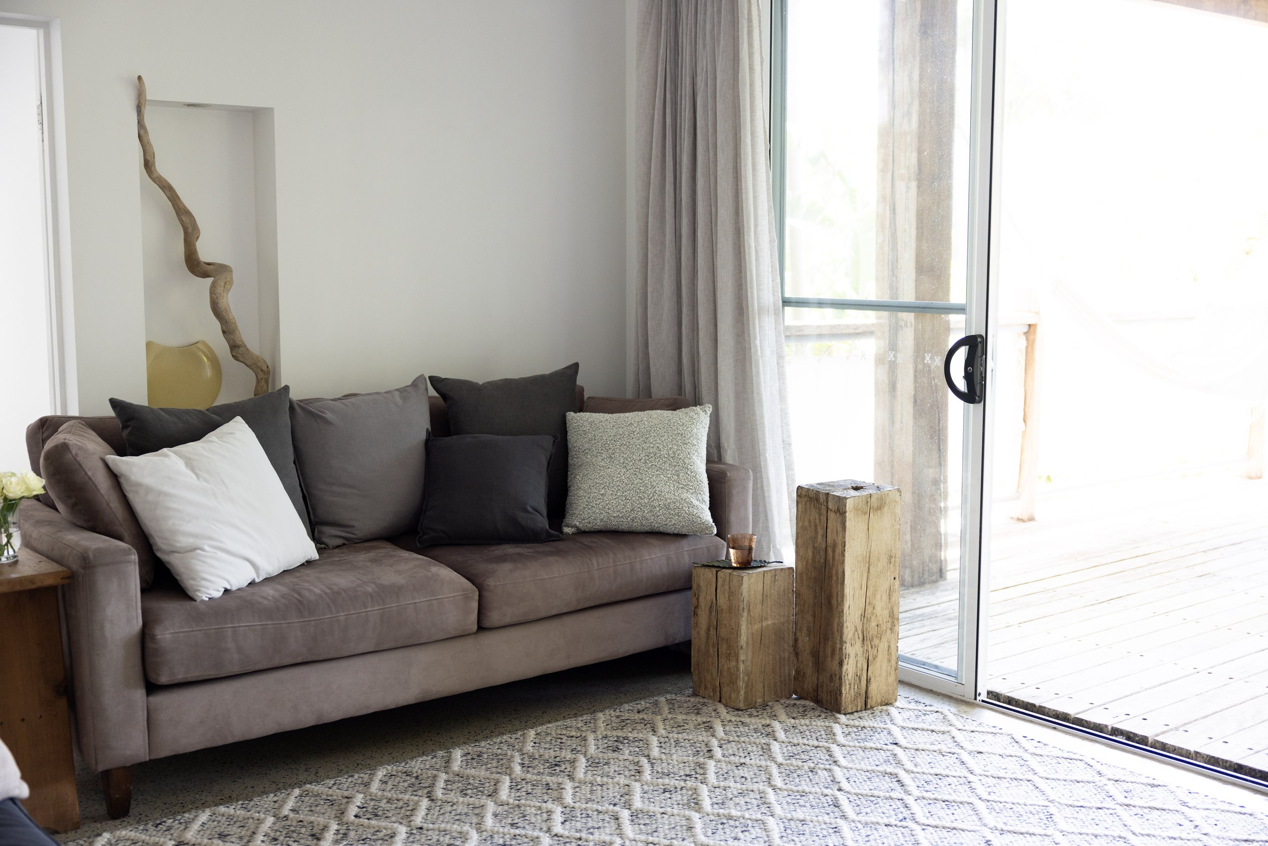 Bright lounge area with natural light, comfortable seating, and muted earthy tones at Haven Tropicana.