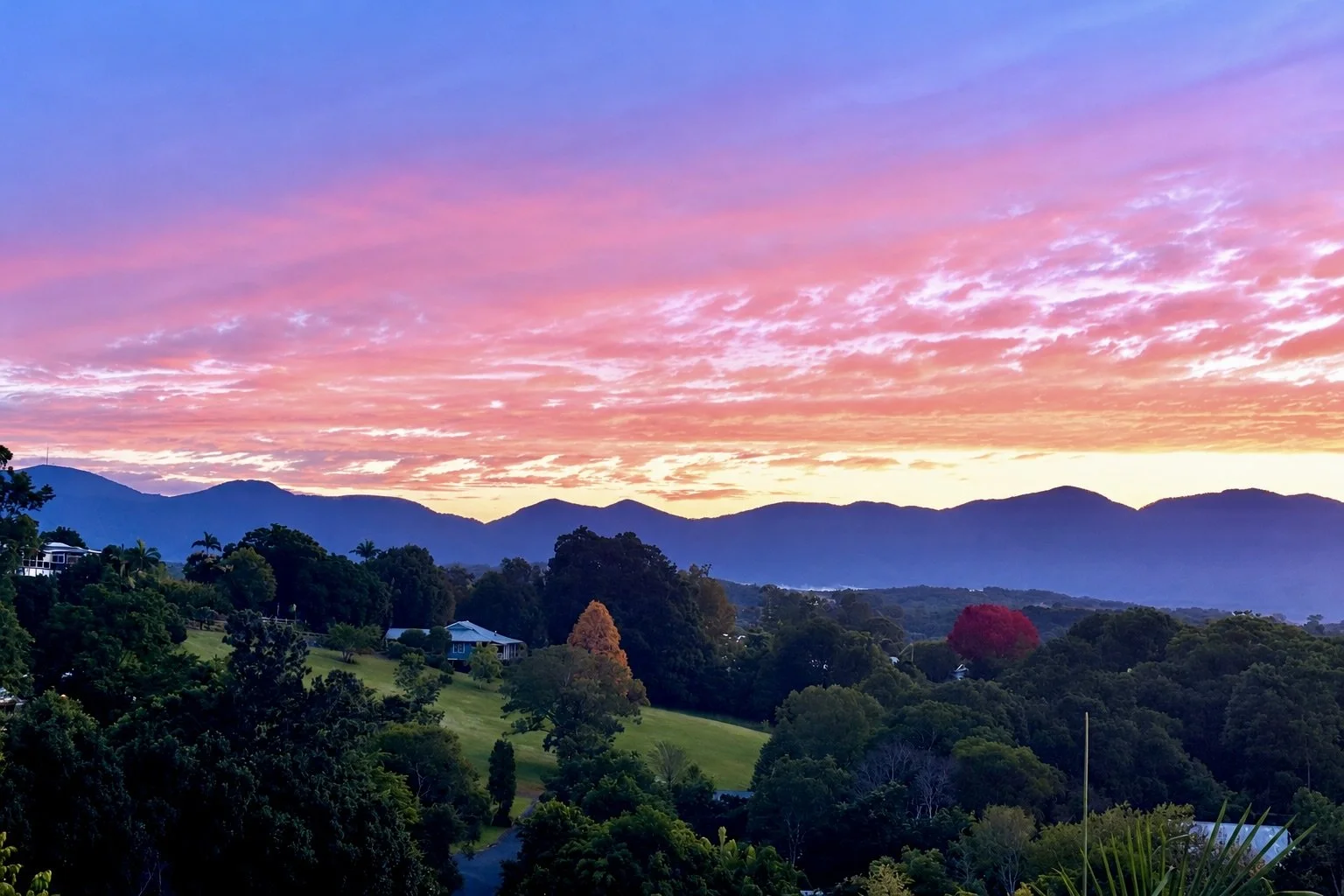 Vivid Sunset Over a Lush Mountain Valley.jpeg