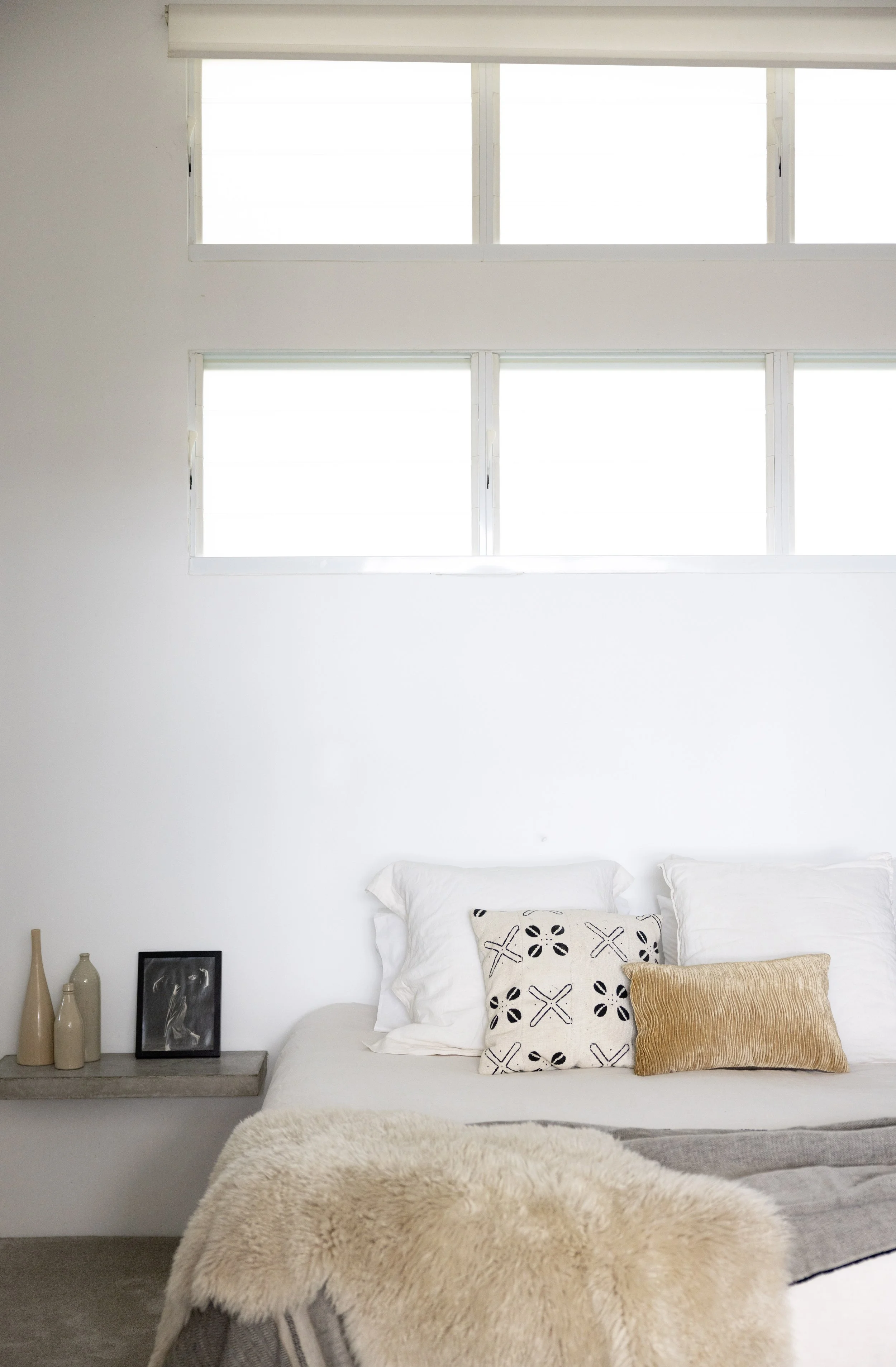 Minimalist coastal King bedroom styling at Haven Oceana