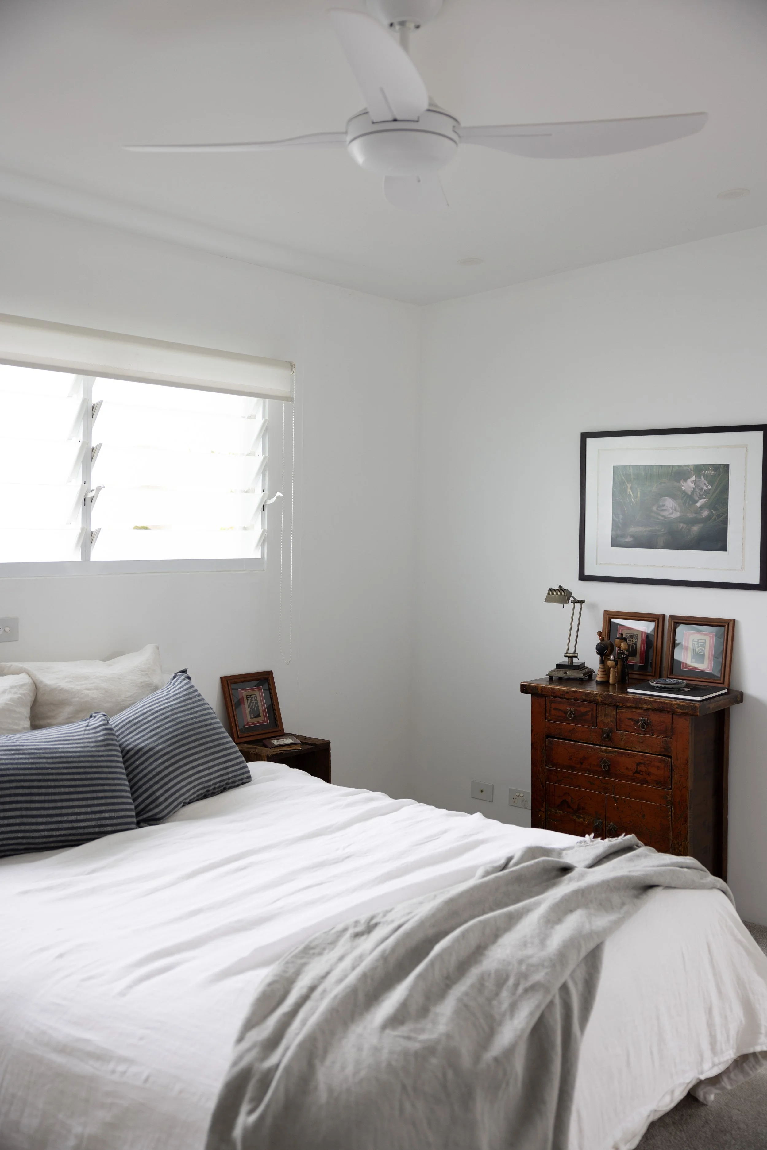 Relaxed coastal Queen bedroom with natural light at Haven Oceana