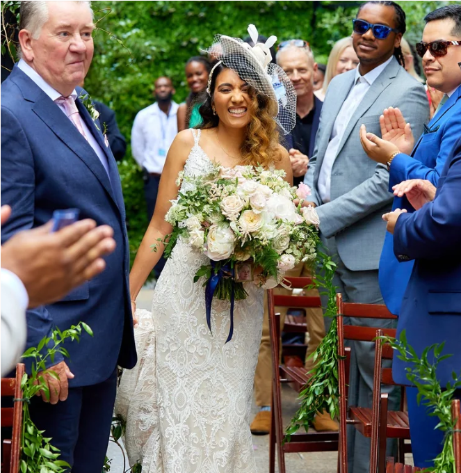 Sarmia & Javier walking down the aisle .png