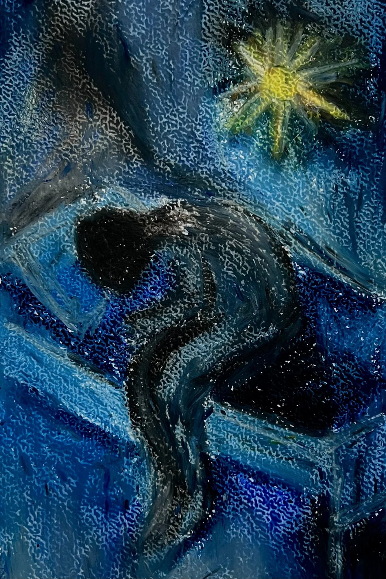 A painting created using oil pastel on watercolour paper has a dark character sitting in a crouched position on a bed. There appears to be a yellow star shape in the otherwise blue background.
