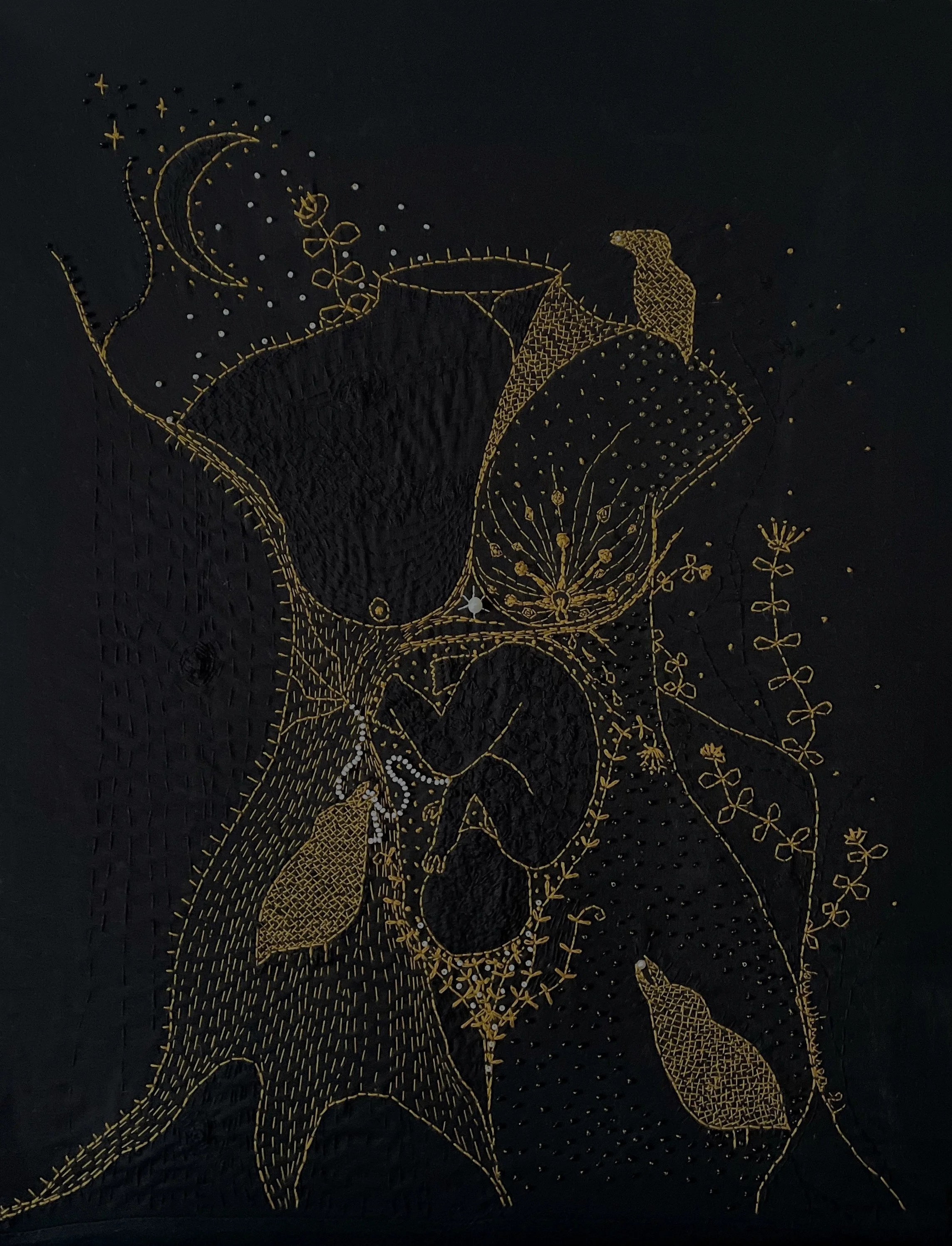 A female torso embroidered in yellow on black fabric. A human fetus grows in utero. Part of her body is a tree trunk. A stalk of honeysuckle climbs around her. Three corvid birds watch over the unborn child: one holds its umbilical cord in its beak.