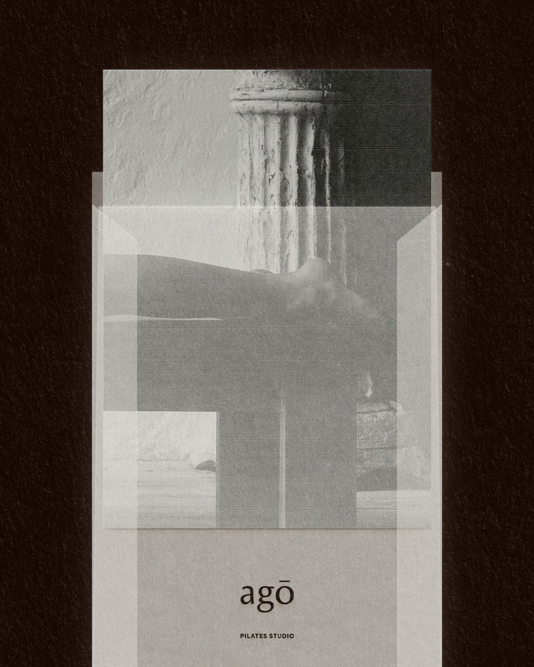 A minimalist promotional poster for Agō Pilates Studio featuring a black and white photograph of a classical column with a textured background, overlaid with semi-transparent rectangles and the text "agō" in lowercase and "PILATES STUDIO" below.