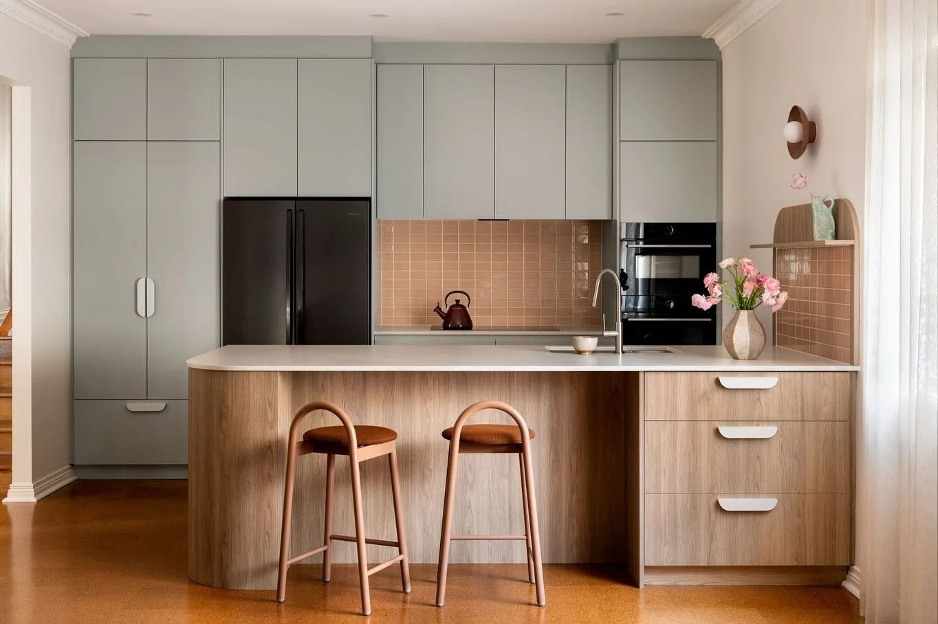 Buena Vista X Order Co.

Full frontal kitchen before and after.

From the before pic, you can tell we had a soft spot for the existing cabinetry colour so we carried that tone into the new design. This time, we balanced it out with light walnut and a