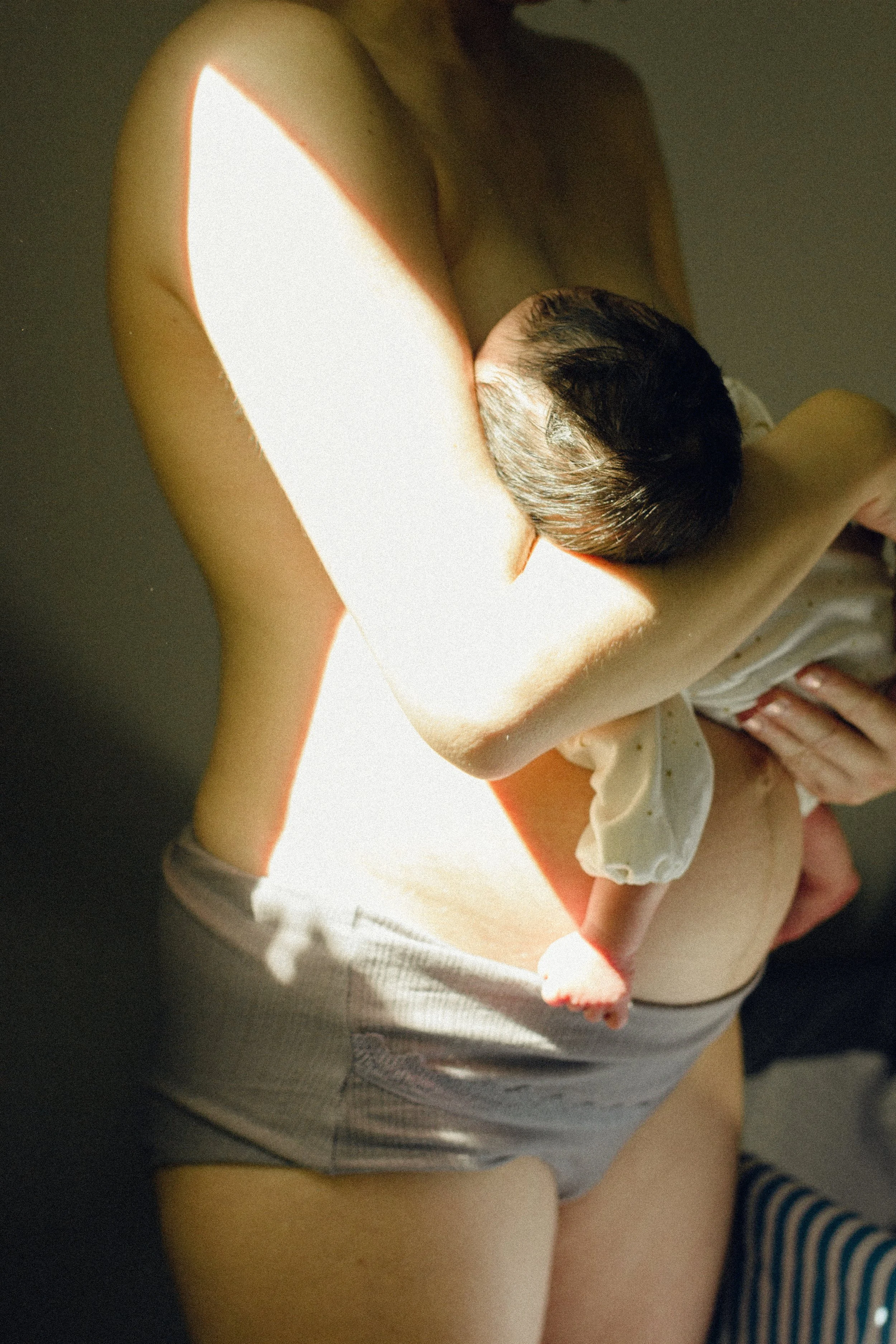 An intimate portrait of a woman’s body 24 hours after birth, documenting the raw and beautiful transition into motherhood in Tokyo.