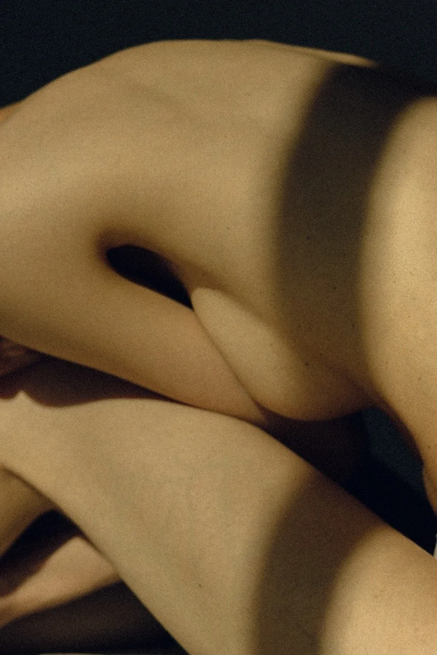 Abstract close up of a woman's body in warm golden light — intimate fine art portrait photography exploring the female body by Noa Nguyen, Tokyo.