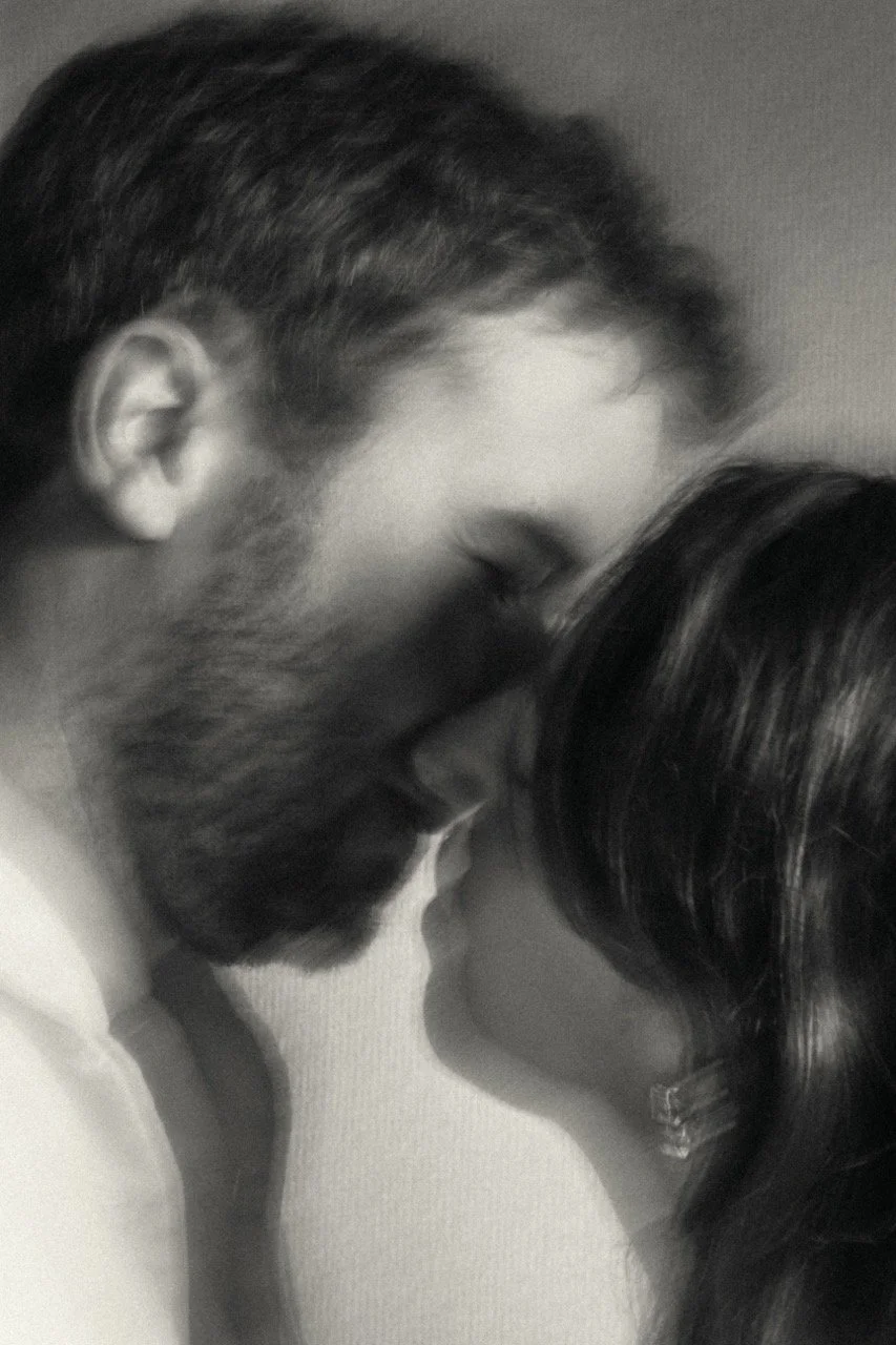 A soft-focus, grainy film look portrait of a couple sharing an intimate moment during their travels in Tokyo
