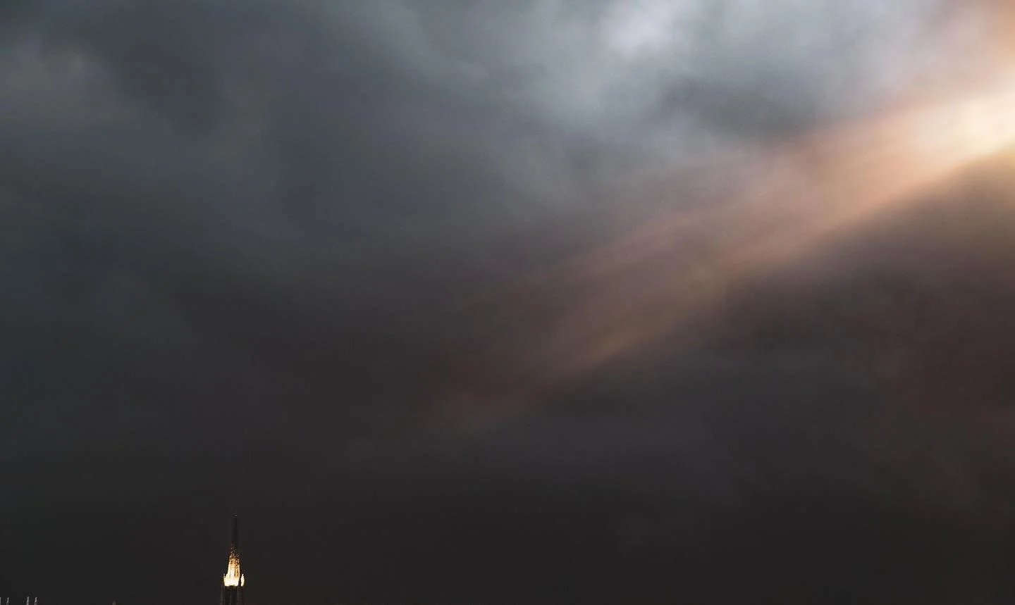 A storm is a coming. Tropical storm Colin is making his way up the coast. This image was a happy accident. As I was taking the image, the parking deck lights came on and this light leak appeared. 

#photography #wilmingtonnc #clouds #stormclouds #pho