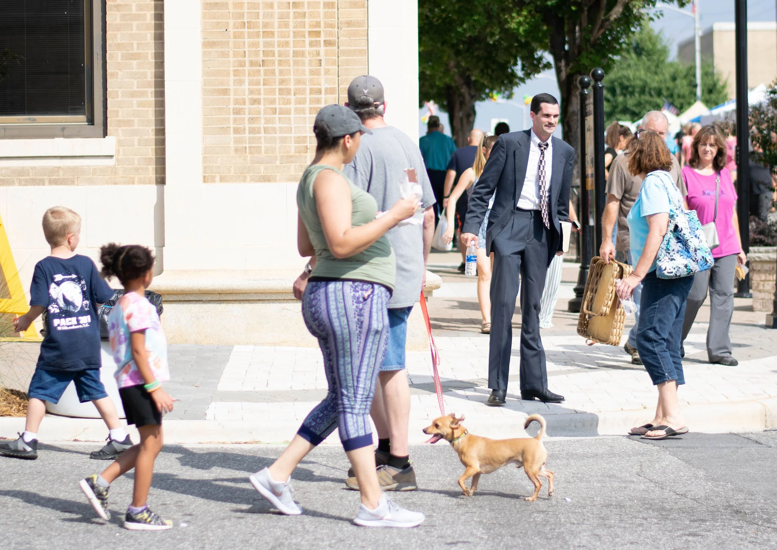 A woman speaks to a street preacher at the Brushy Mountain Apple Festival in Wilkesboro, NC.