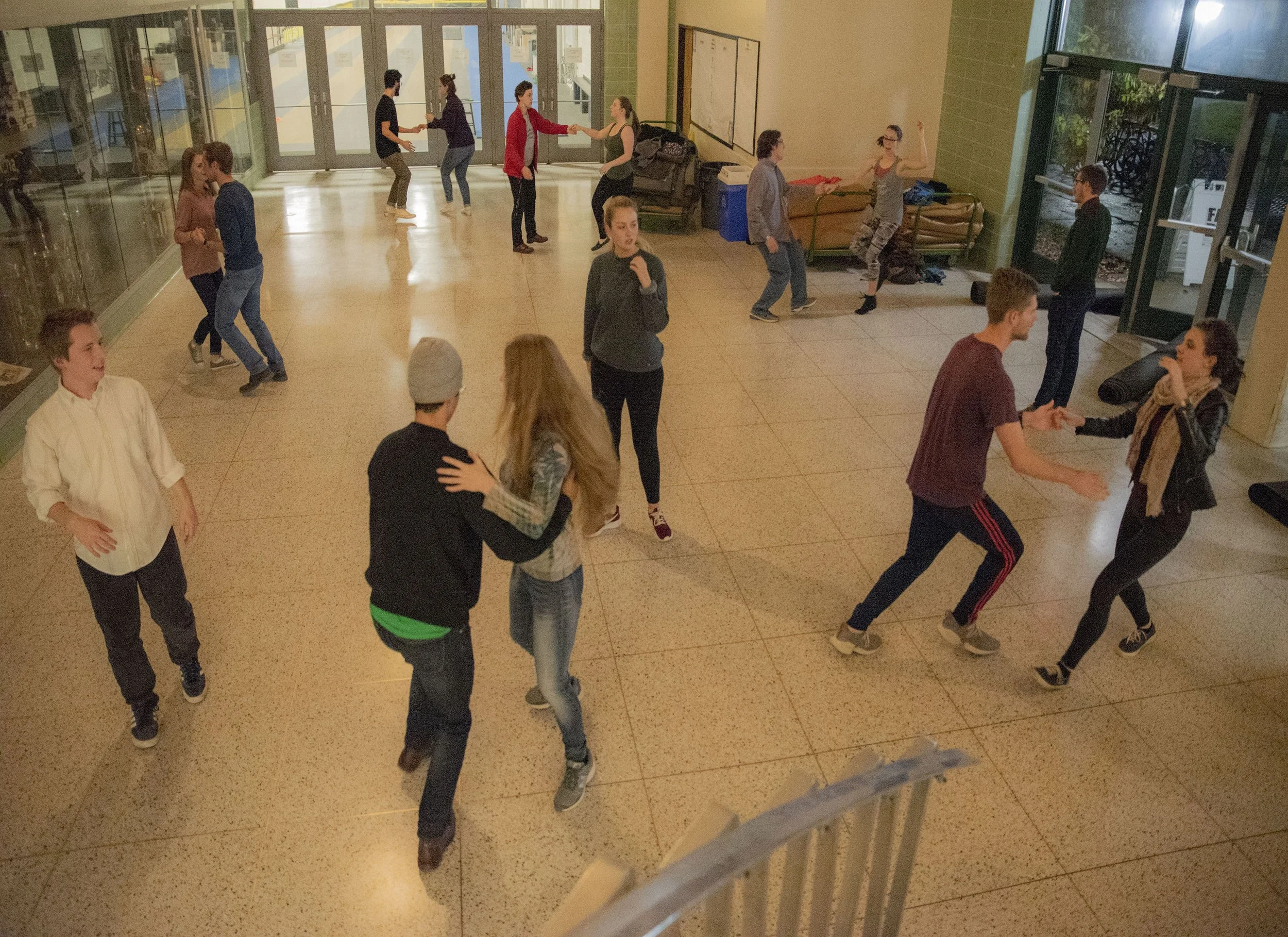 The Swing Dance Club at Appalachian State University practices in a circle as instructors look on.