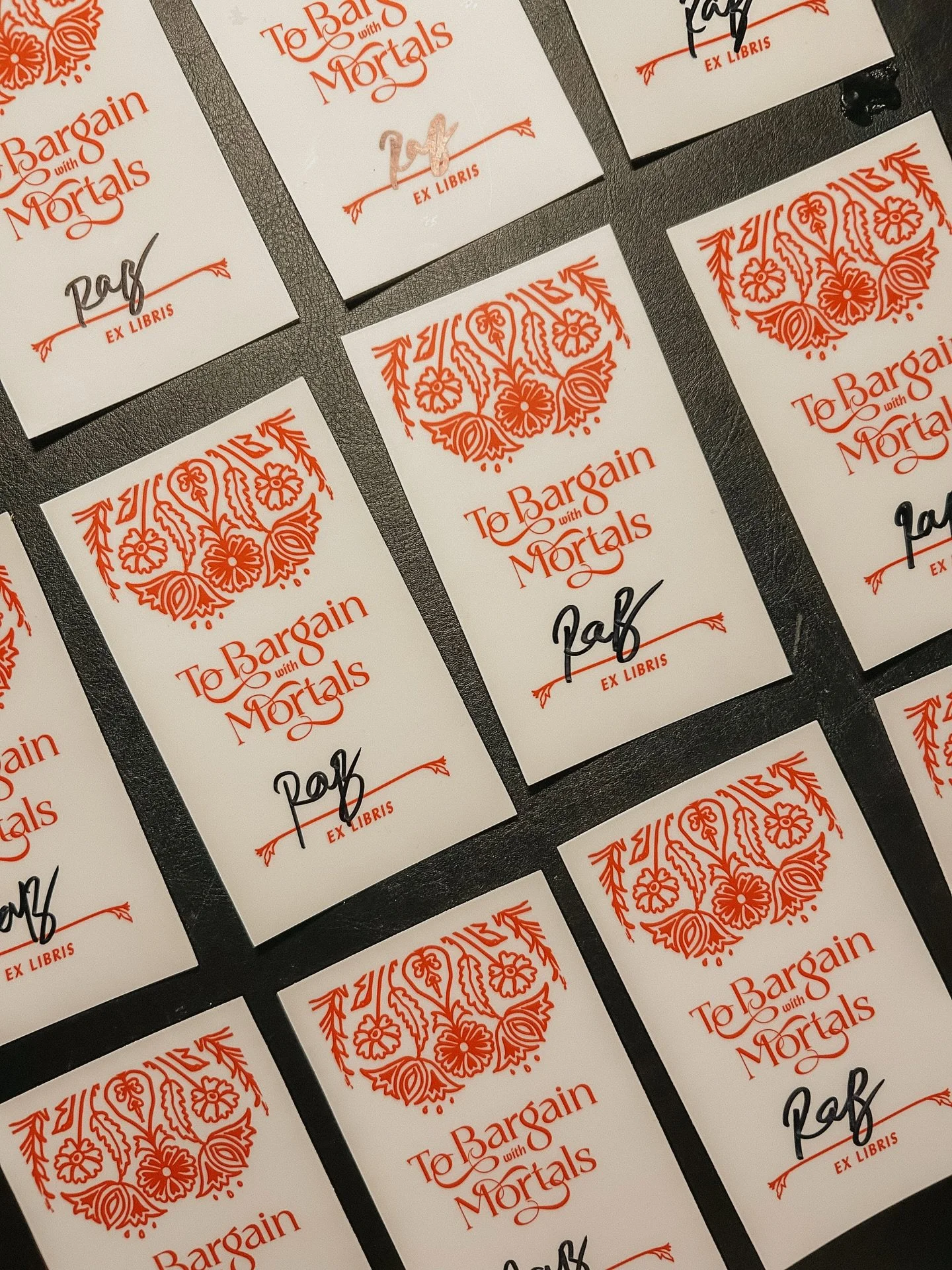 finished signing all the bookplates that will go out as part of the TBWM pre-order campaign!! in addition to the bookplates we are also doing digital downloads of phone backgrounds, as well as an annotated first chapter with running commentary by mys