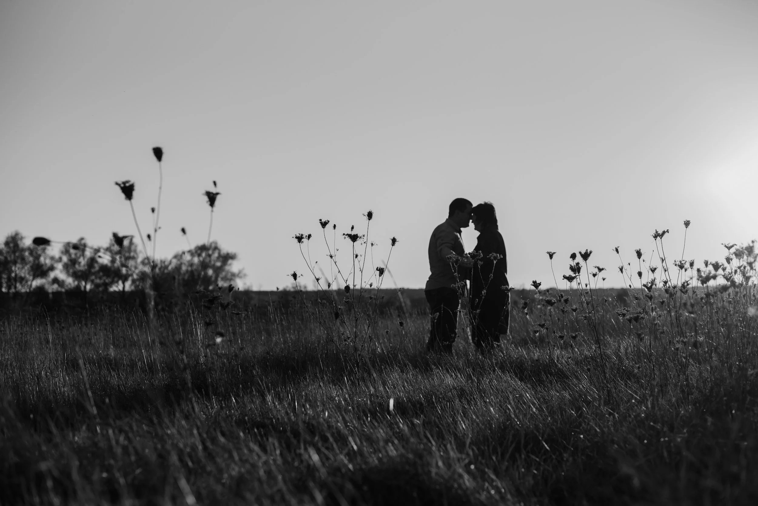 Black and white image of two people in a field