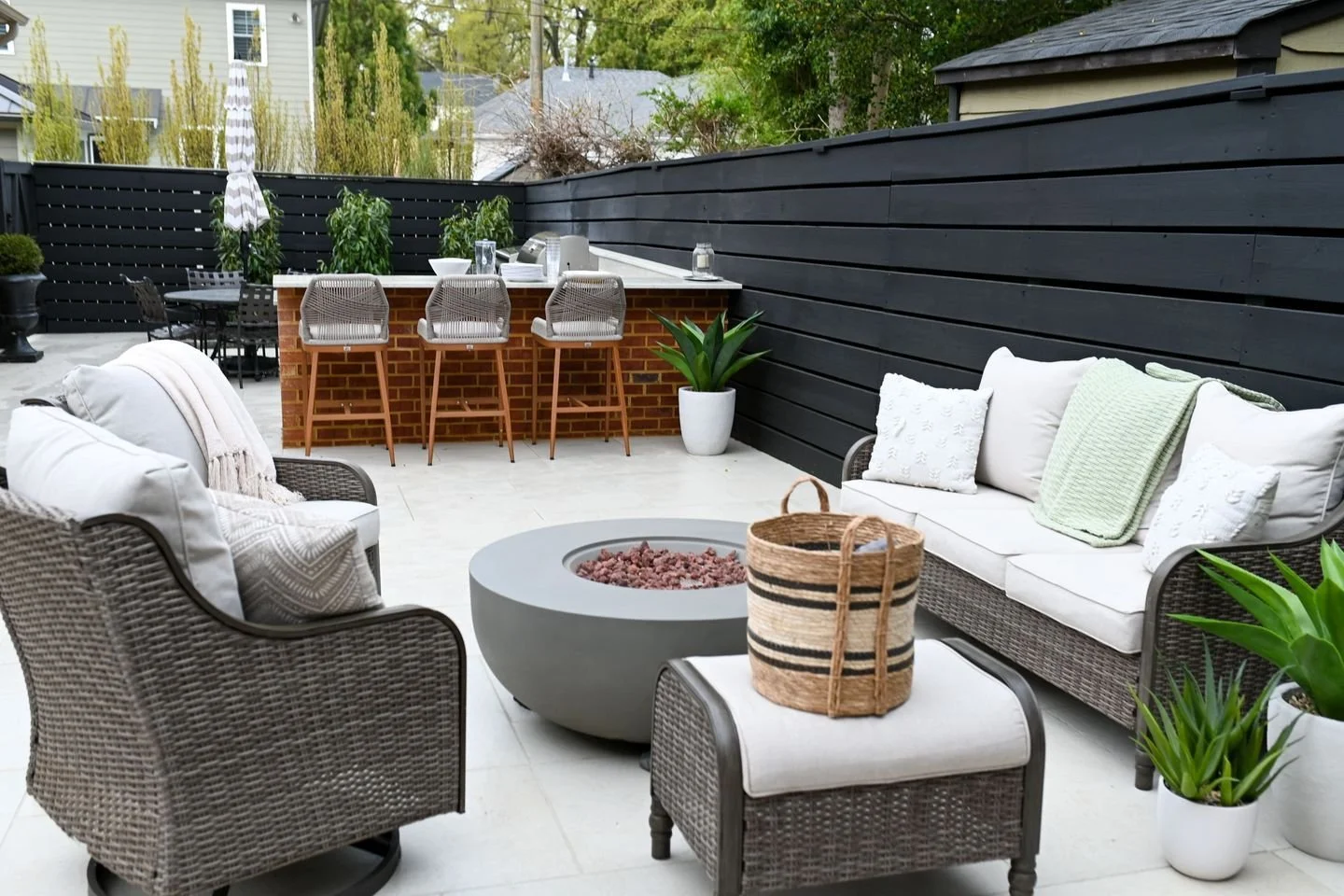 Swipe to see the transformation from a simple seating area to a complete outdoor living and dining experience.