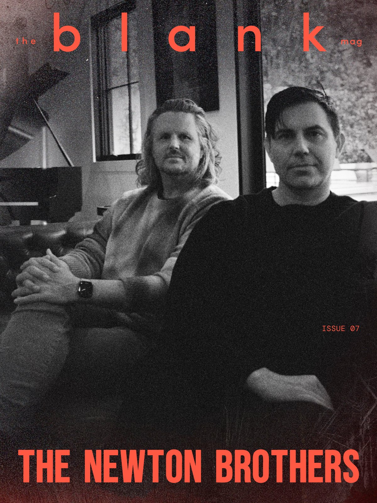 Black and white cover of a magazine titled 'the black mag' featuring two men sitting indoors with a window behind them, one with long hair and the other with short dark hair, with the text 'ISSUE 07' and 'THE NEWTON BROTHERS'.