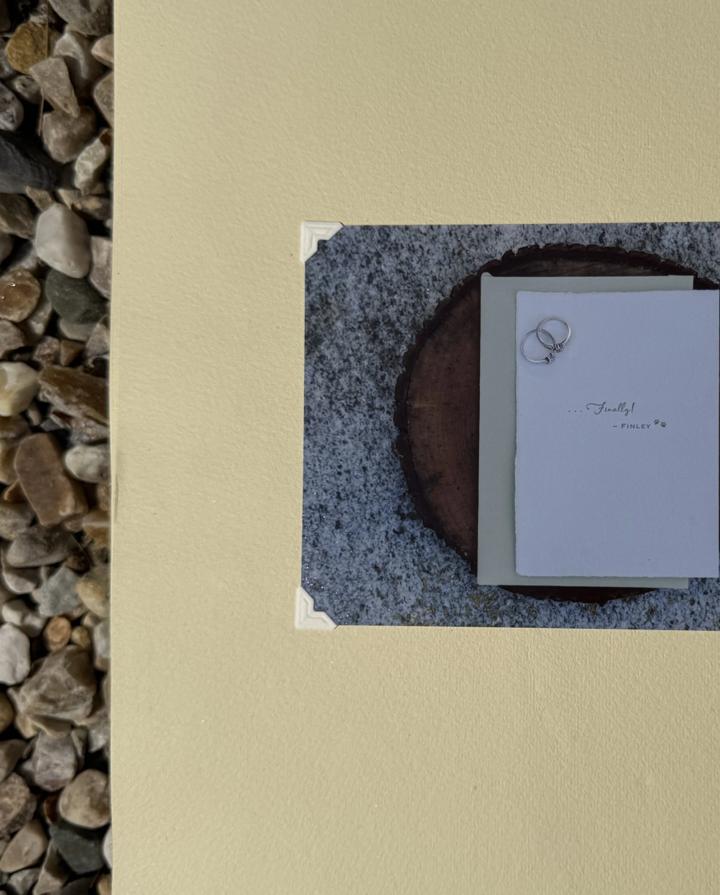 Wedding rings on a white card with the words "Finally!" and the name "Finley".