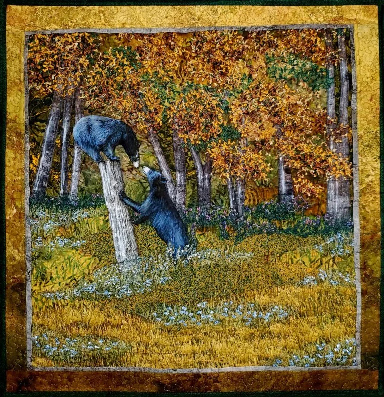Three wildlife-themed quilts